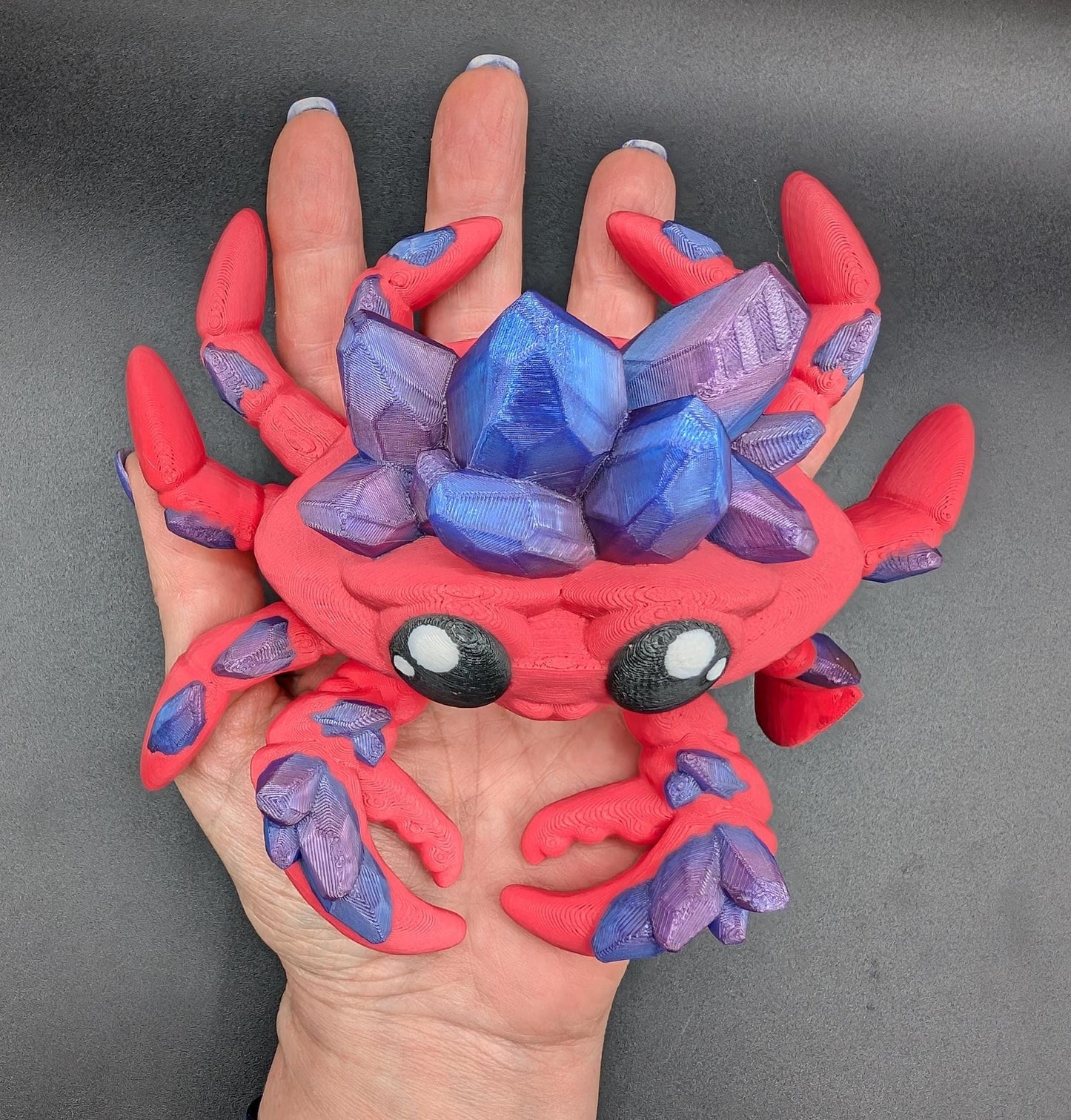 Introducing our Articulated Crystal Gemstone Crab Fidget Toy, a captivating blend of beauty and stress relief. Perfect for fidget enthusiasts and ocean lovers, this charming crab offers a unique way to unwind.