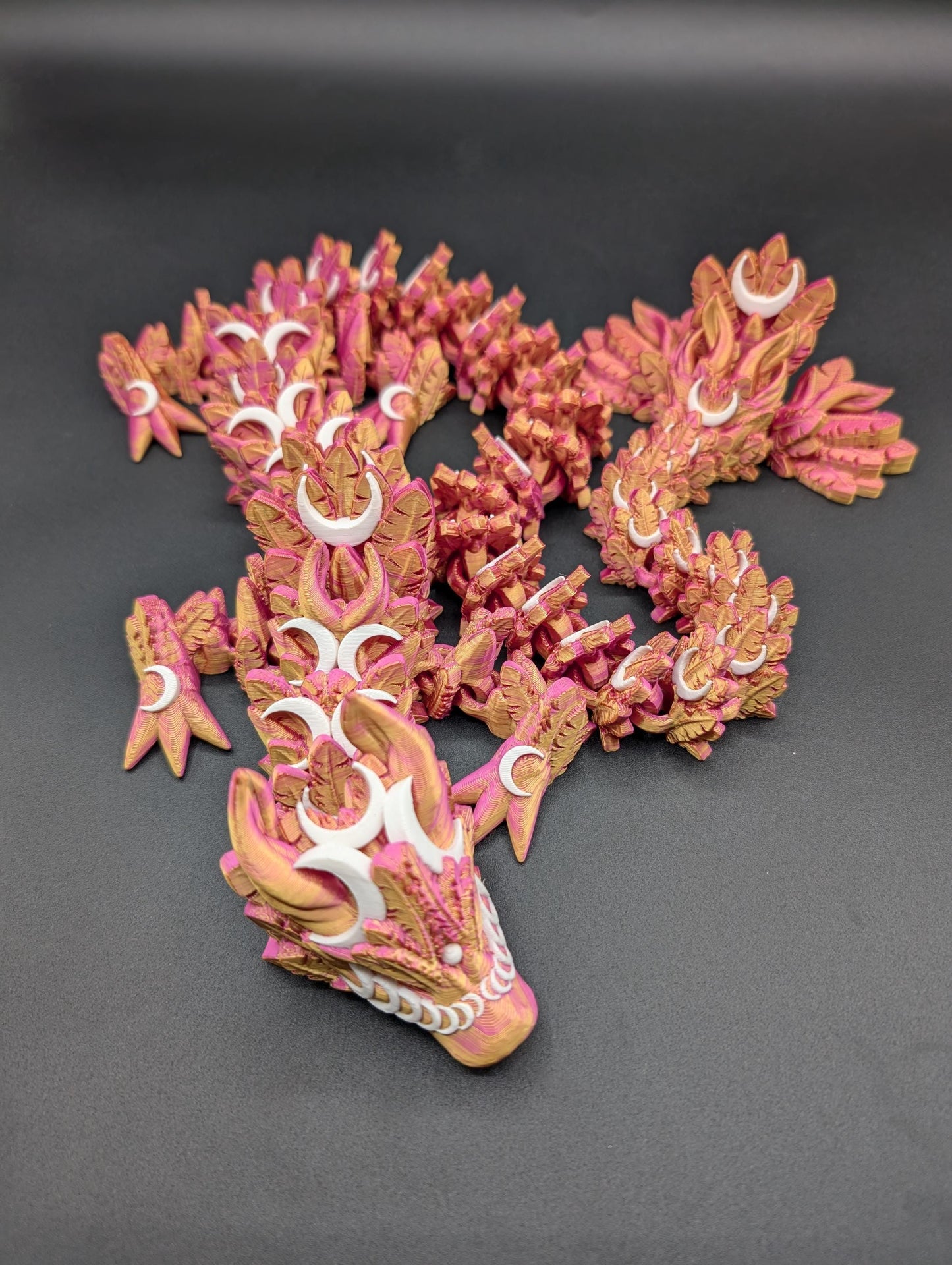 Introducing our Mystical Lunar Dragon, a captivating piece perfect for fantasy lovers and collectors alike. This ethereal dragon is designed to add a touch of magic and wonder to any space.