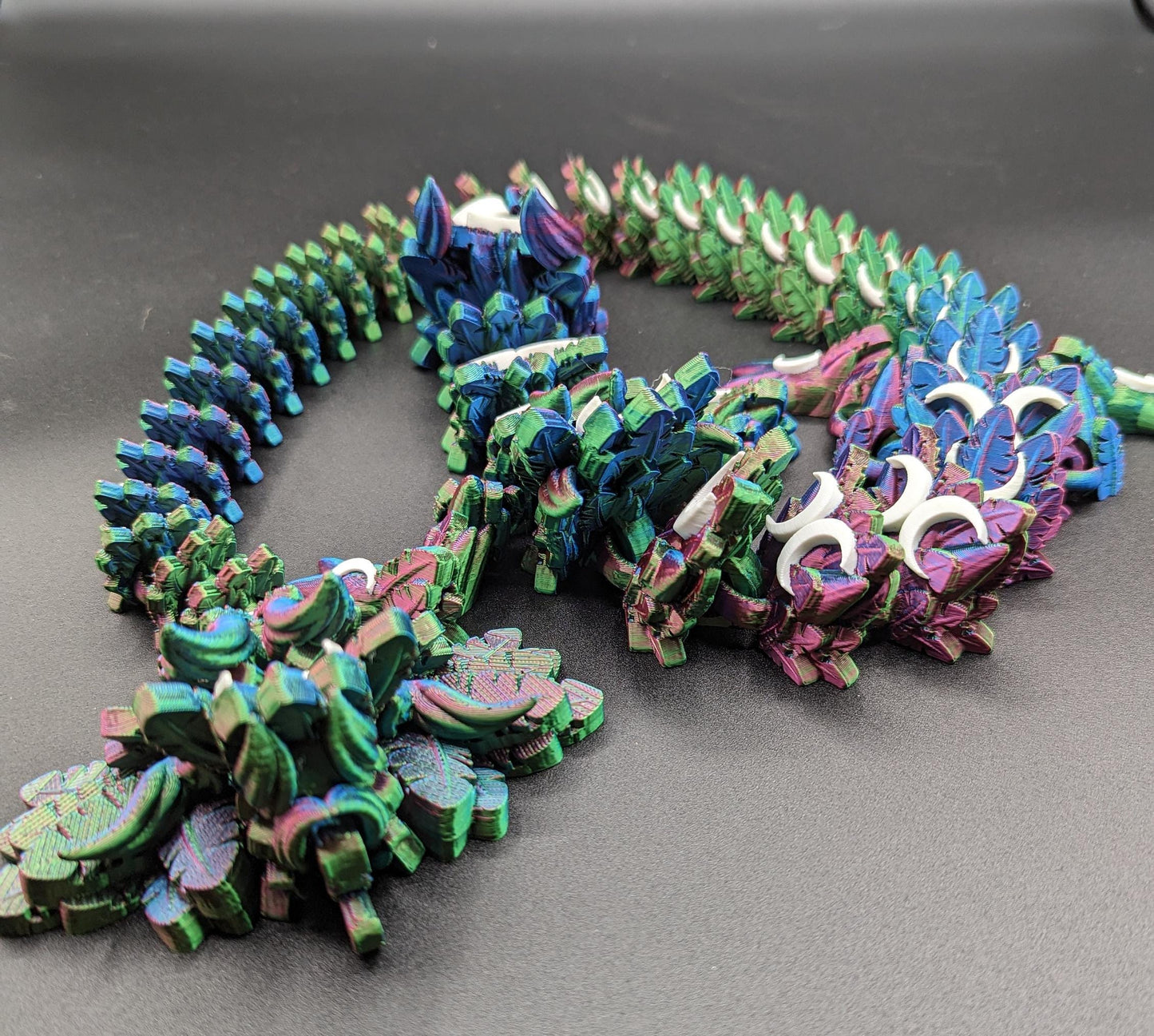 Introducing our Mystical Lunar Dragon, a captivating piece perfect for fantasy lovers and collectors alike. This ethereal dragon is designed to add a touch of magic and wonder to any space.