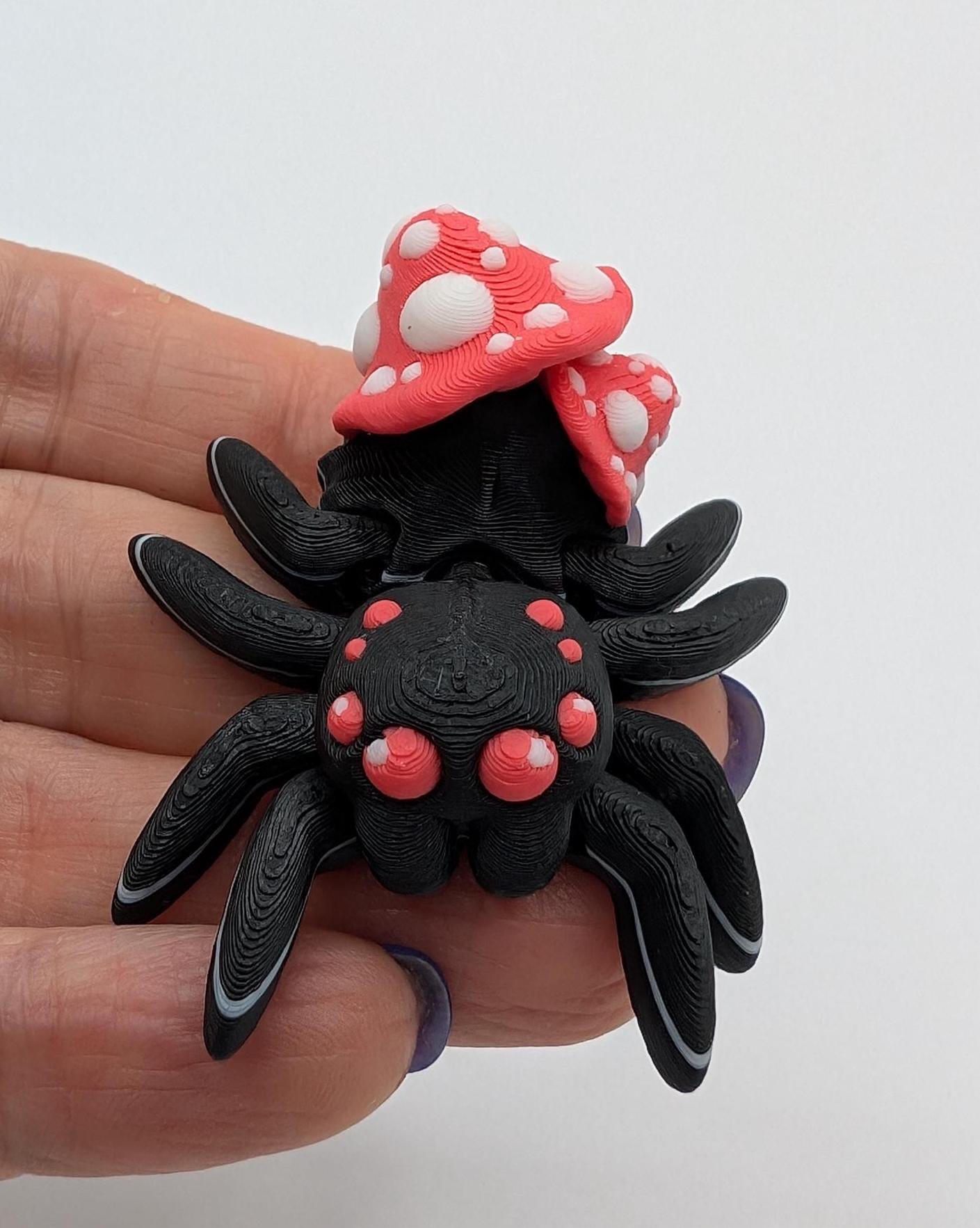 Introducing our Cute Articulated Mushroom Spider, a delightful fusion of nature and imagination. Perfect for anyone who loves unique decor, this charming spider is sure to bring a smile to your face.