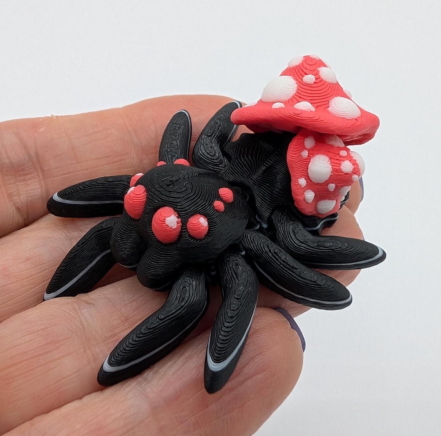Introducing our Cute Articulated Mushroom Spider, a delightful fusion of nature and imagination. Perfect for anyone who loves unique decor, this charming spider is sure to bring a smile to your face.