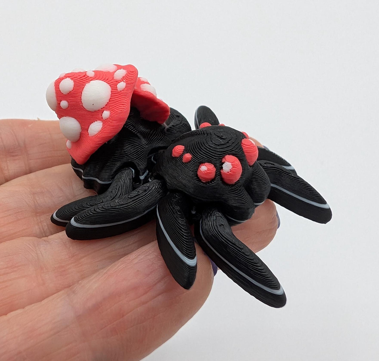 Introducing our Cute Articulated Mushroom Spider, a delightful fusion of nature and imagination. Perfect for anyone who loves unique decor, this charming spider is sure to bring a smile to your face.