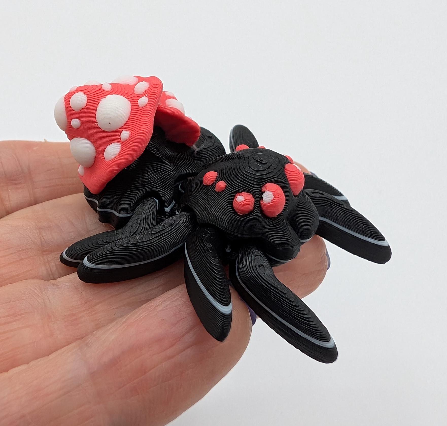 Introducing our Cute Articulated Mushroom Spider, a delightful fusion of nature and imagination. Perfect for anyone who loves unique decor, this charming spider is sure to bring a smile to your face.