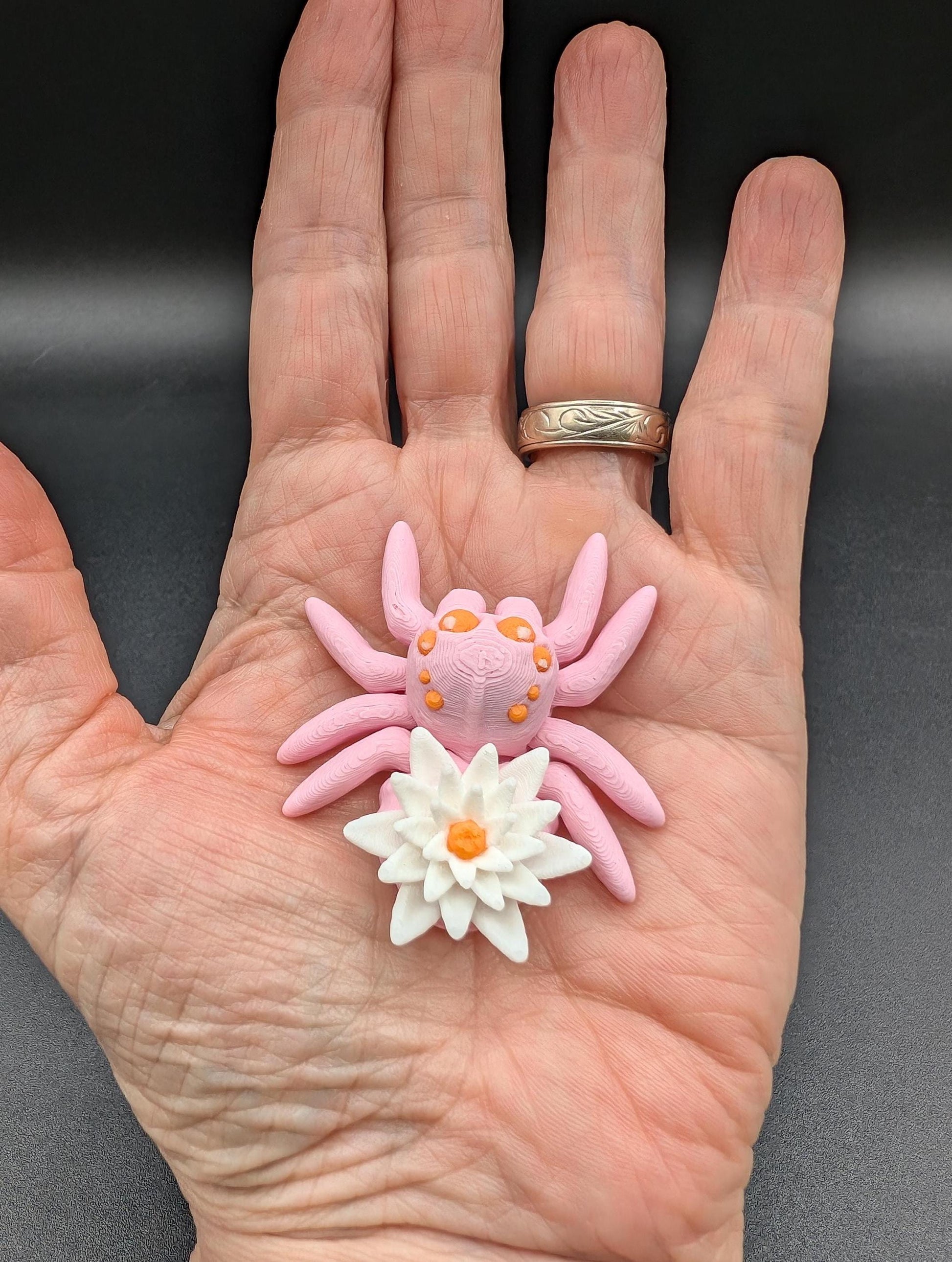 Introducing our Beautiful Articulating Water Lily Spider, a stunning blend of nature and art. Perfect for collectors and decor enthusiasts, this unique spider adds a touch of grace and whimsy to any space.
