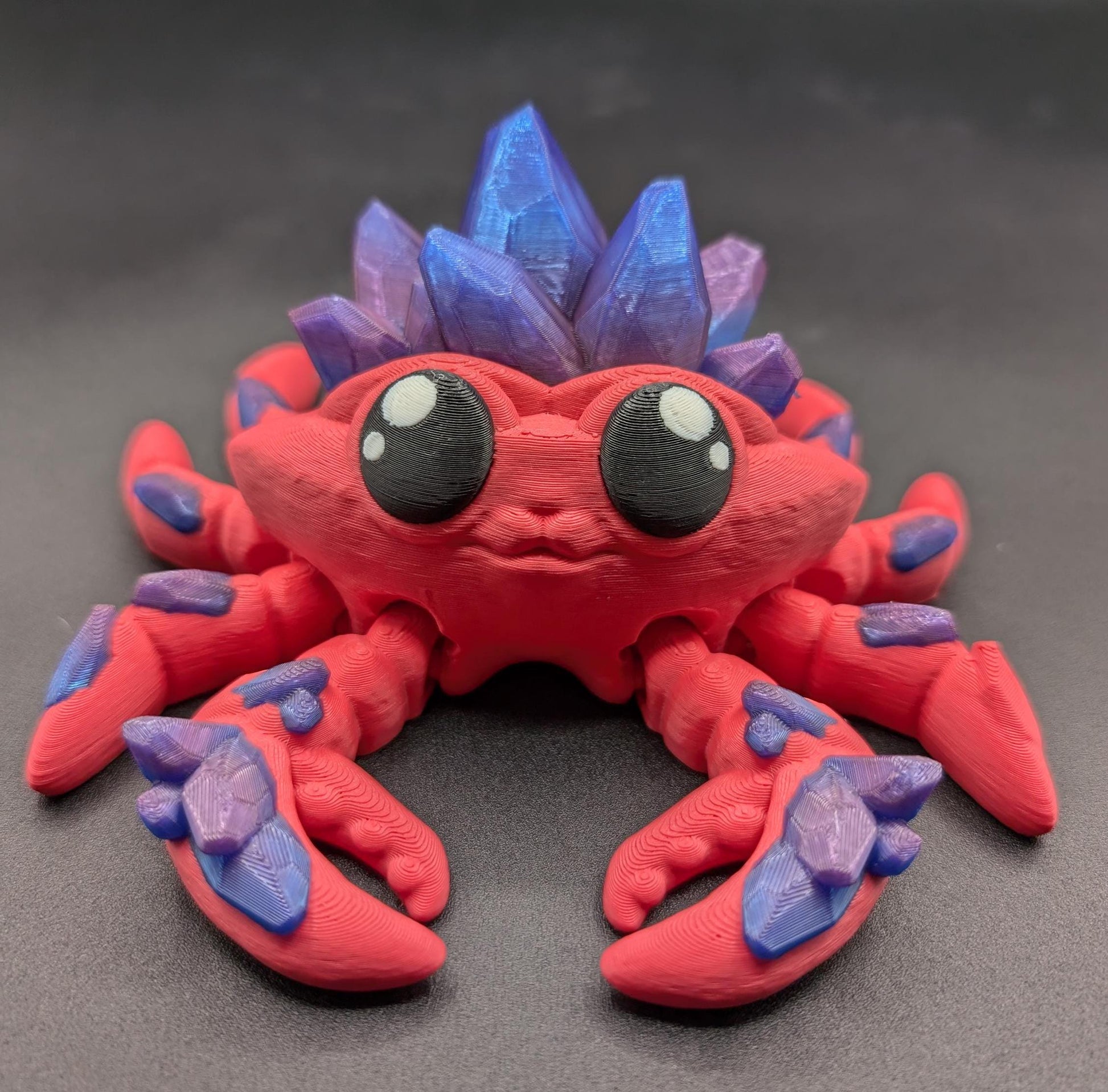 Introducing our Articulated Crystal Gemstone Crab Fidget Toy, a captivating blend of beauty and stress relief. Perfect for fidget enthusiasts and ocean lovers, this charming crab offers a unique way to unwind.