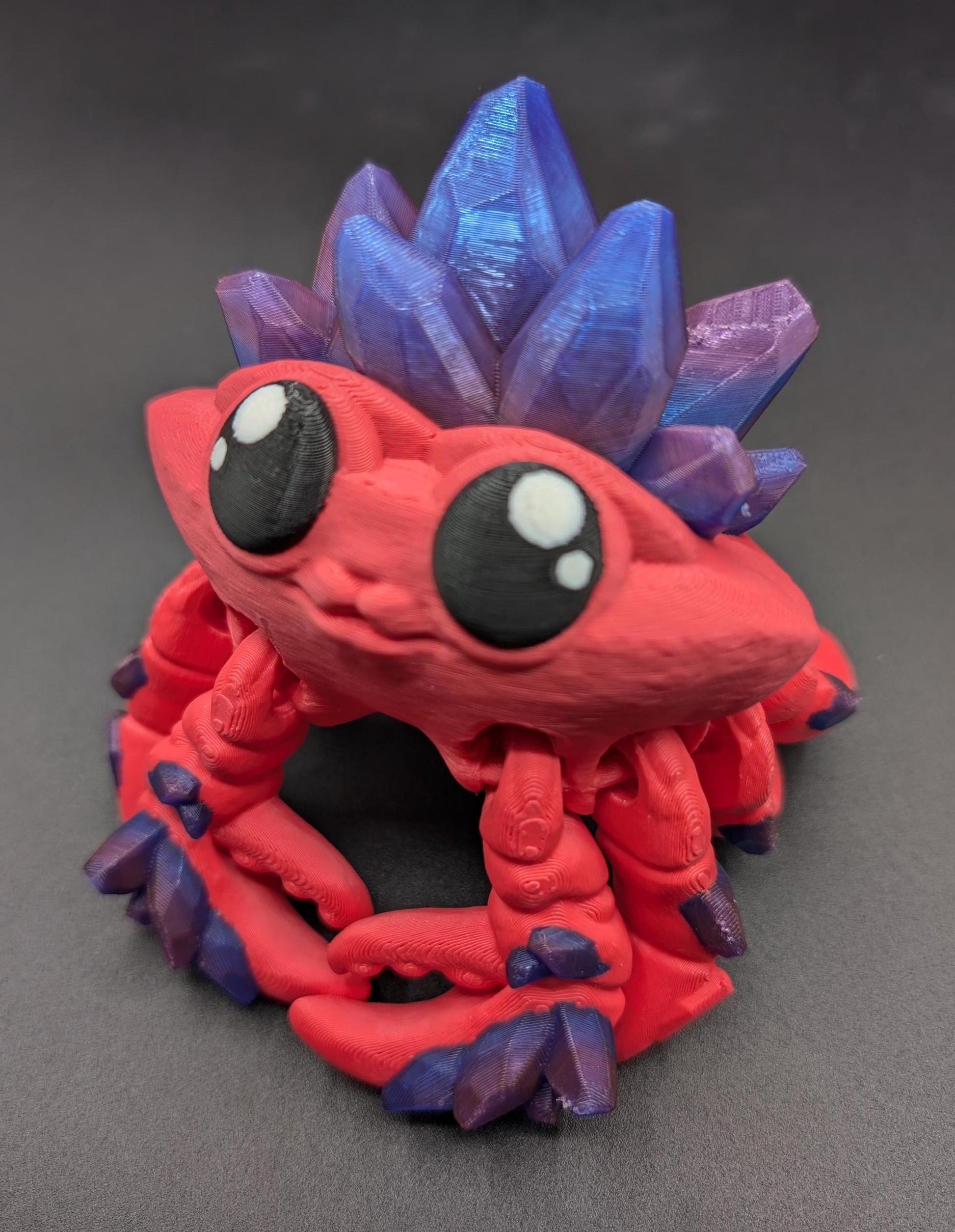 Introducing our Articulated Crystal Gemstone Crab Fidget Toy, a captivating blend of beauty and stress relief. Perfect for fidget enthusiasts and ocean lovers, this charming crab offers a unique way to unwind.