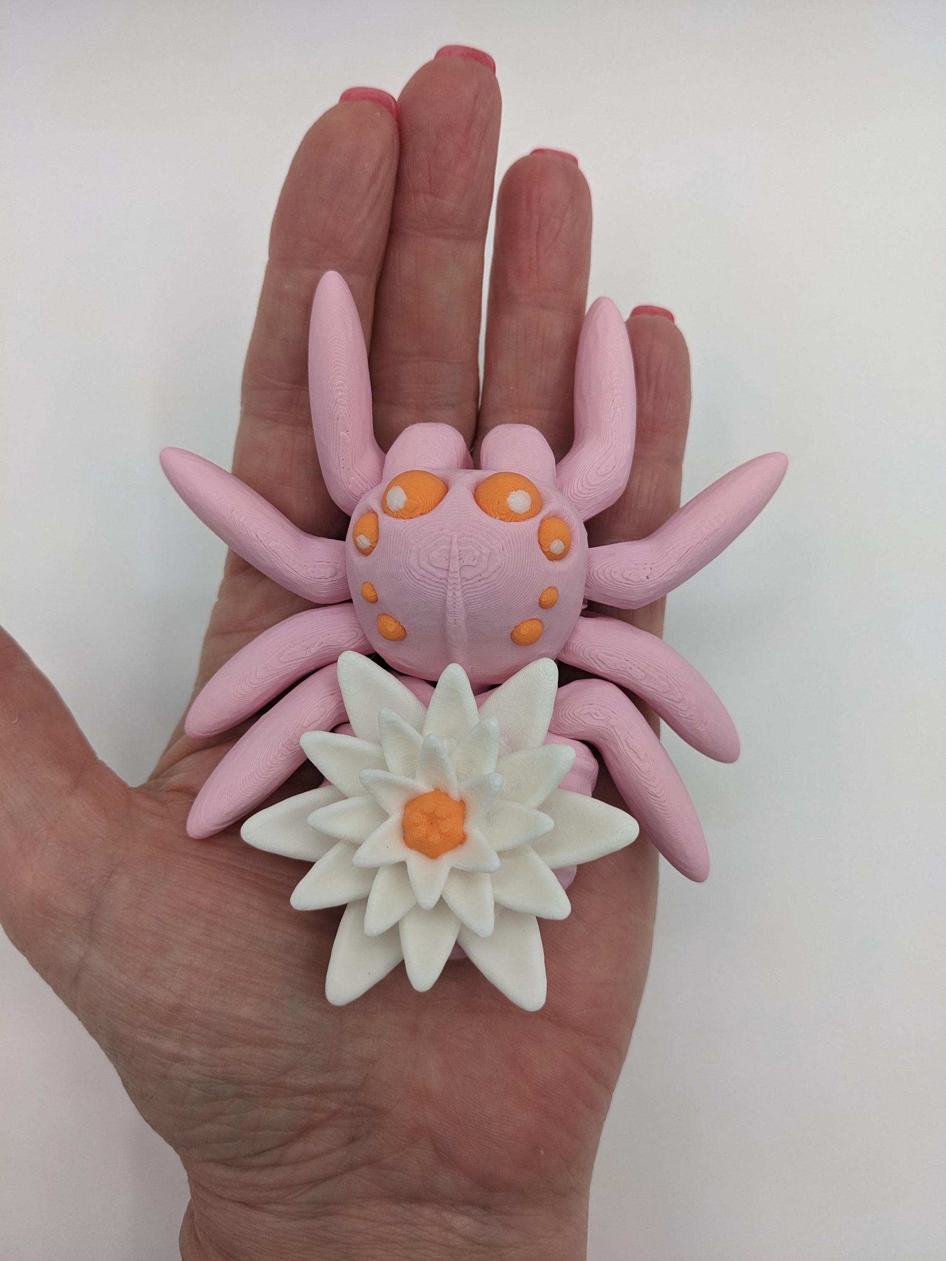 Introducing our Beautiful Articulating Water Lily Spider, a stunning blend of nature and art. Perfect for collectors and decor enthusiasts, this unique spider adds a touch of grace and whimsy to any space.