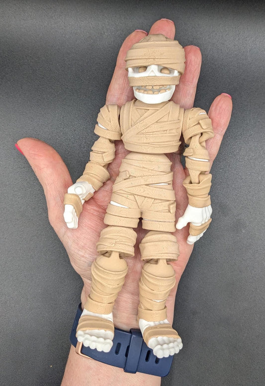 Introducing our Spooky Articulated Mummy Fidget Toy, a perfect blend of eerie charm and stress relief. Ideal for Halloween lovers and fidget enthusiasts, this mummy offers a unique way to relax and enjoy spooky vibes all year round.