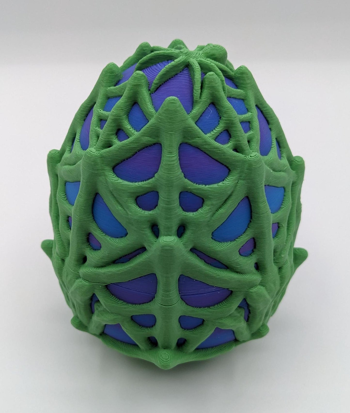 Our Spiderweb Egg with choice of spider captures the spooky fun of the season, a must-have for your festive collection. Perfect for adding a touch of mystery & fun to any room, this spiderweb egg combines intricate design with playful charm.