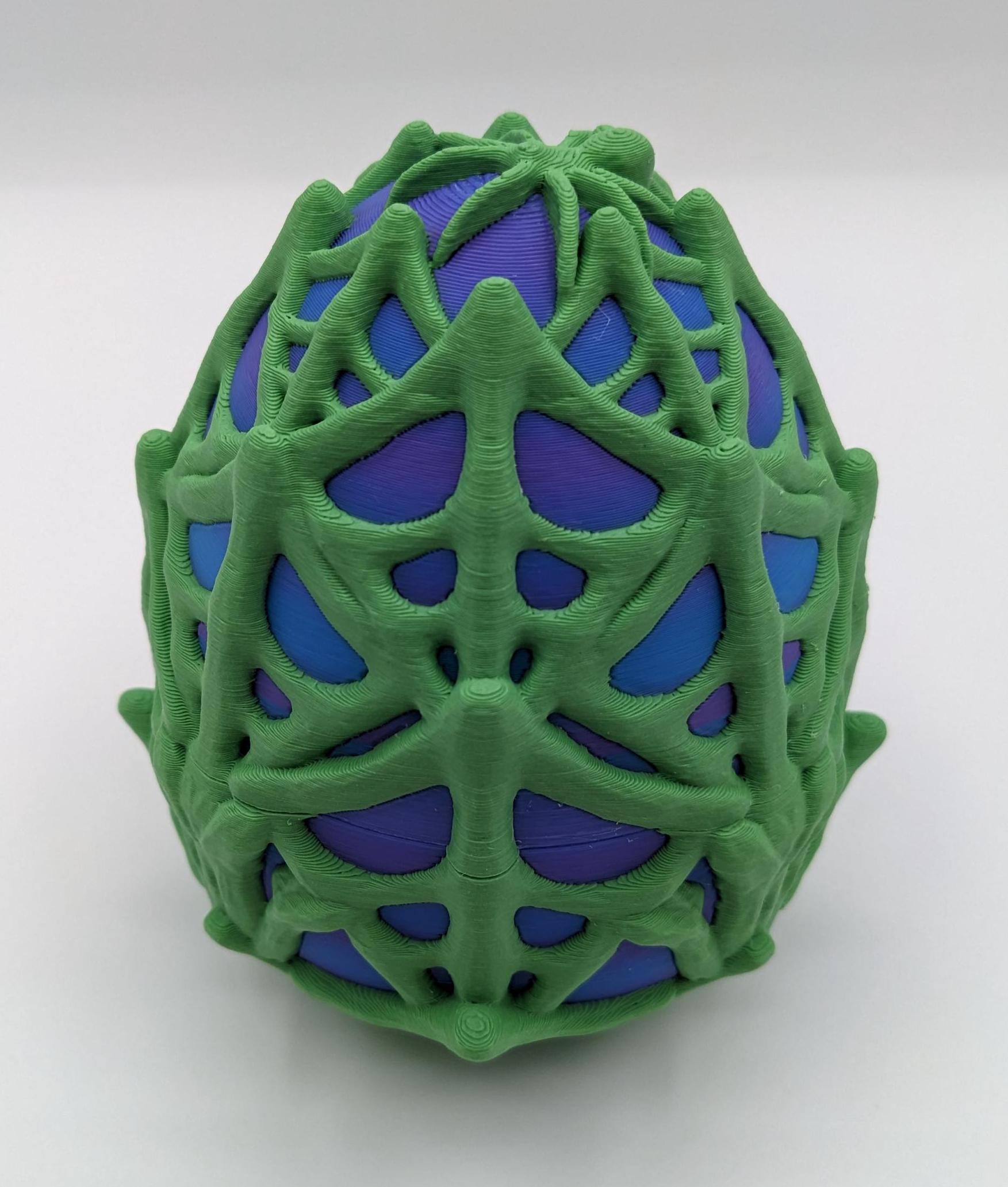 Our Spiderweb Egg with choice of spider captures the spooky fun of the season, a must-have for your festive collection. Perfect for adding a touch of mystery & fun to any room, this spiderweb egg combines intricate design with playful charm.