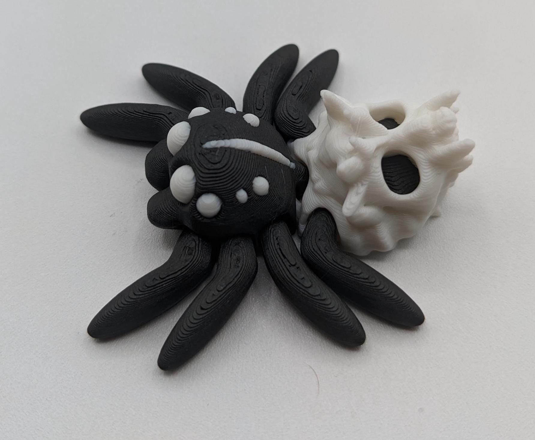Introducing our Spooky Halloween Skull Spider Fidget Toy, a unique blend of eerie charm and stress relief. Perfect for Halloween enthusiasts and fidget fans, this spider toy offers a fun way to unwind and celebrate the season.