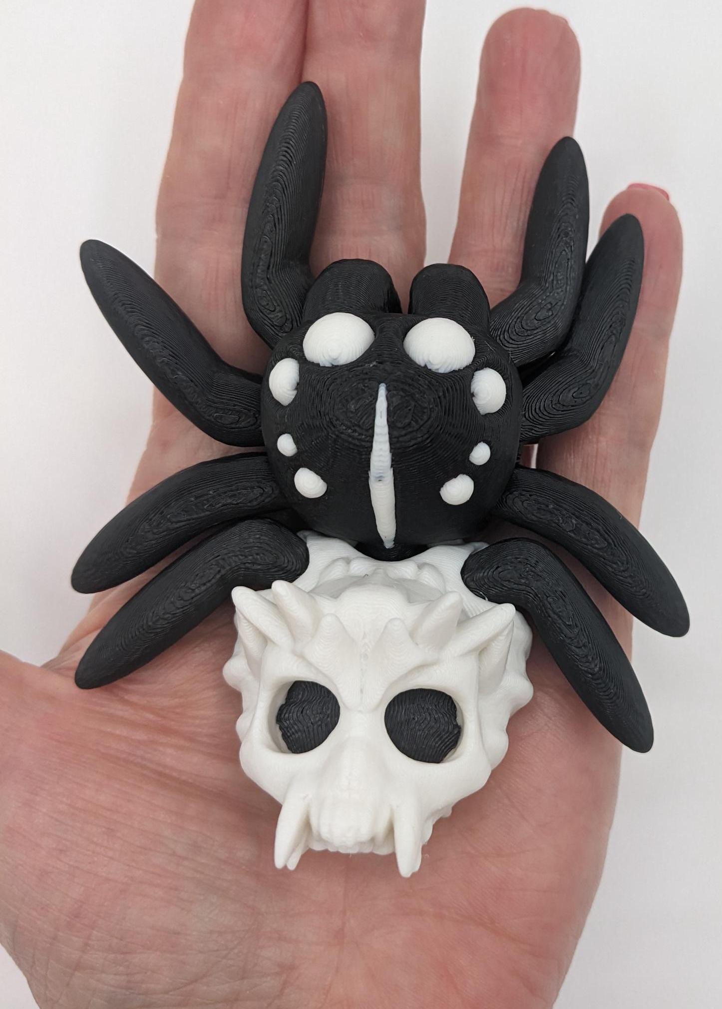 Introducing our Spooky Halloween Skull Spider Fidget Toy, a unique blend of eerie charm and stress relief. Perfect for Halloween enthusiasts and fidget fans, this spider toy offers a fun way to unwind and celebrate the season.