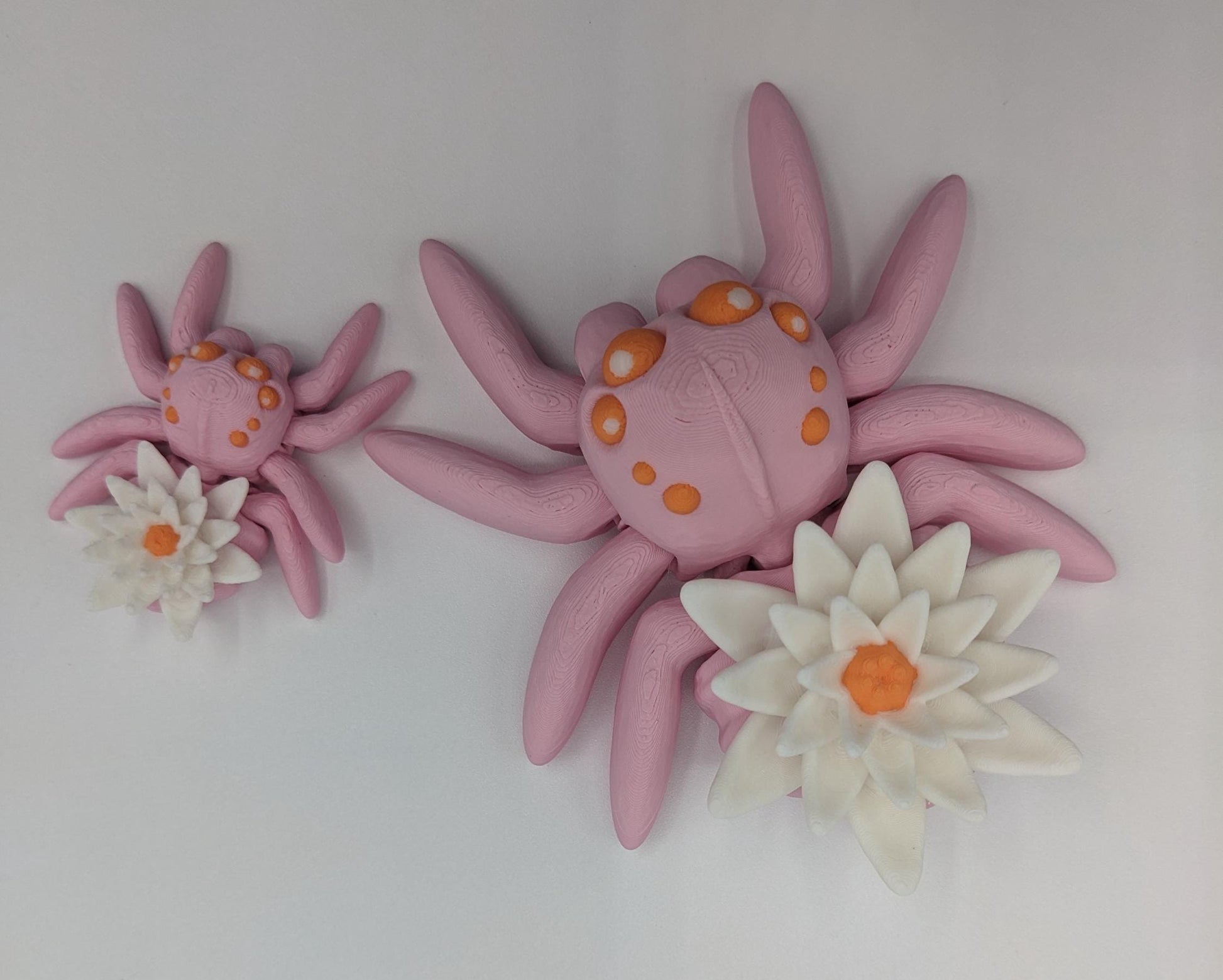 Introducing our Beautiful Articulating Water Lily Spider, a stunning blend of nature and art. Perfect for collectors and decor enthusiasts, this unique spider adds a touch of grace and whimsy to any space.