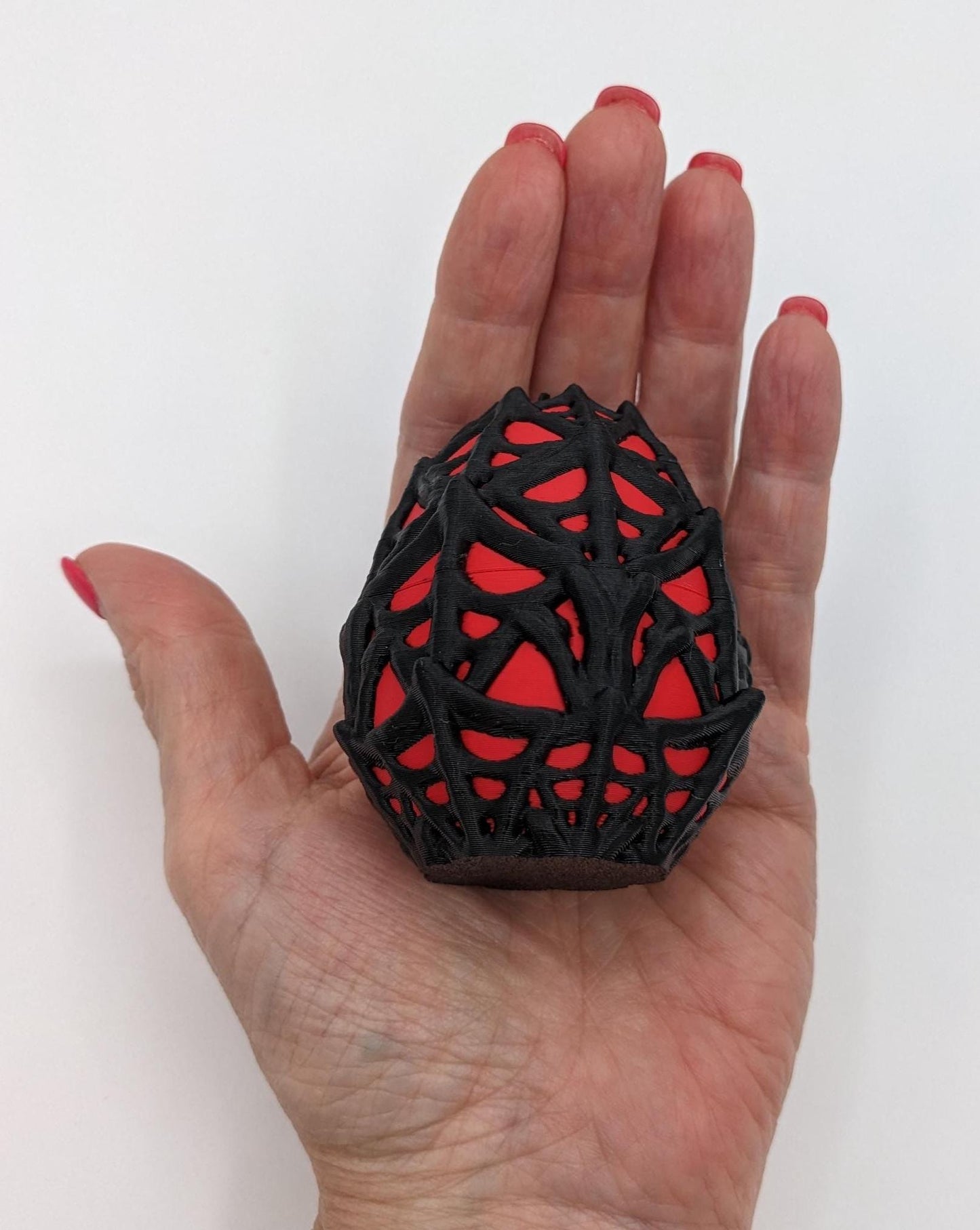 Our Spiderweb Egg with choice of spider captures the spooky fun of the season, a must-have for your festive collection. Perfect for adding a touch of mystery & fun to any room, this spiderweb egg combines intricate design with playful charm.