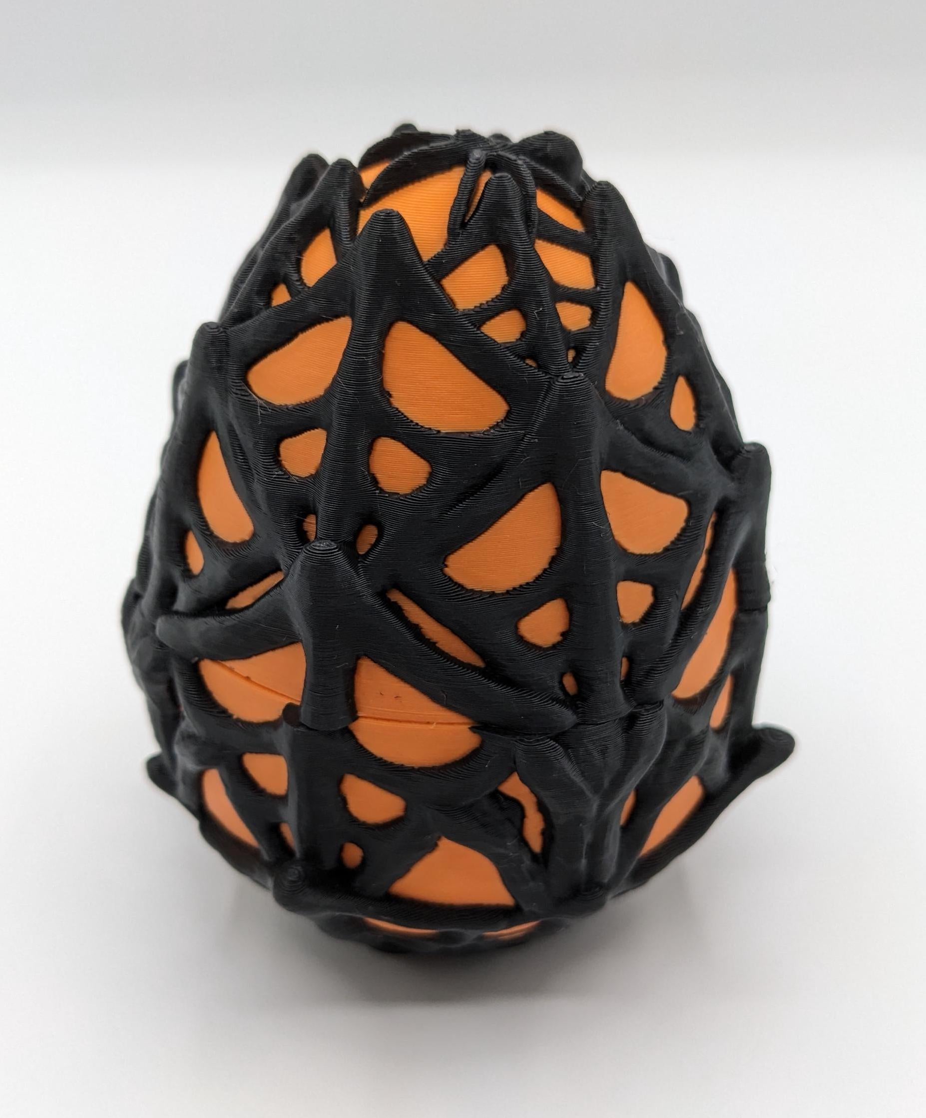 Our Spiderweb Egg with choice of spider captures the spooky fun of the season, a must-have for your festive collection. Perfect for adding a touch of mystery & fun to any room, this spiderweb egg combines intricate design with playful charm.