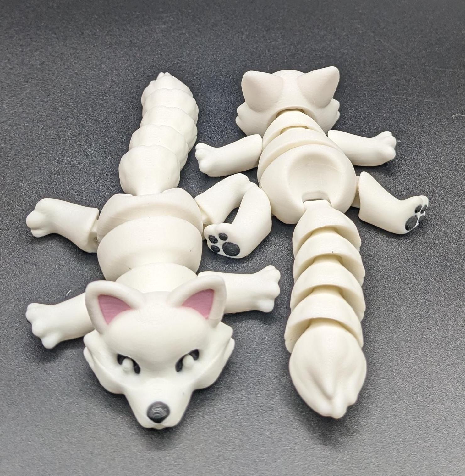 Bring the beauty of the Arctic into your hands with our Articulated Arctic Fox Fidget Toy with movable joints, allowing you to pose & play with it in countless ways. Ideal for fidgeting, stress relief, & imaginative play.