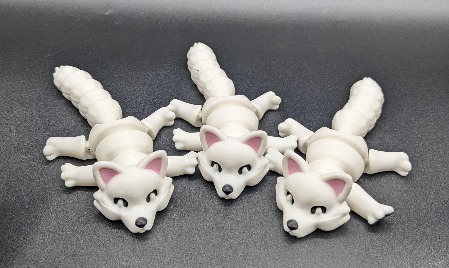 Bring the beauty of the Arctic into your hands with our Articulated Arctic Fox Fidget Toy with movable joints, allowing you to pose & play with it in countless ways. Ideal for fidgeting, stress relief, & imaginative play.