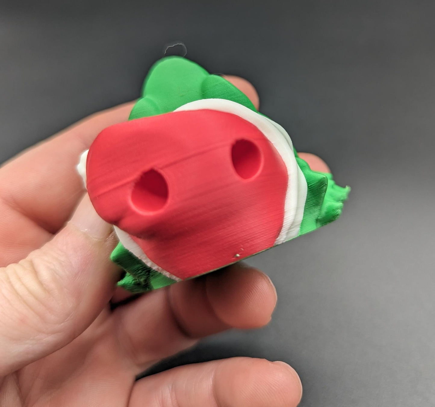 This charming ornament brings a touch of reptilian charm to your Christmas tree, making it a delightful and unique way to celebrate the season.