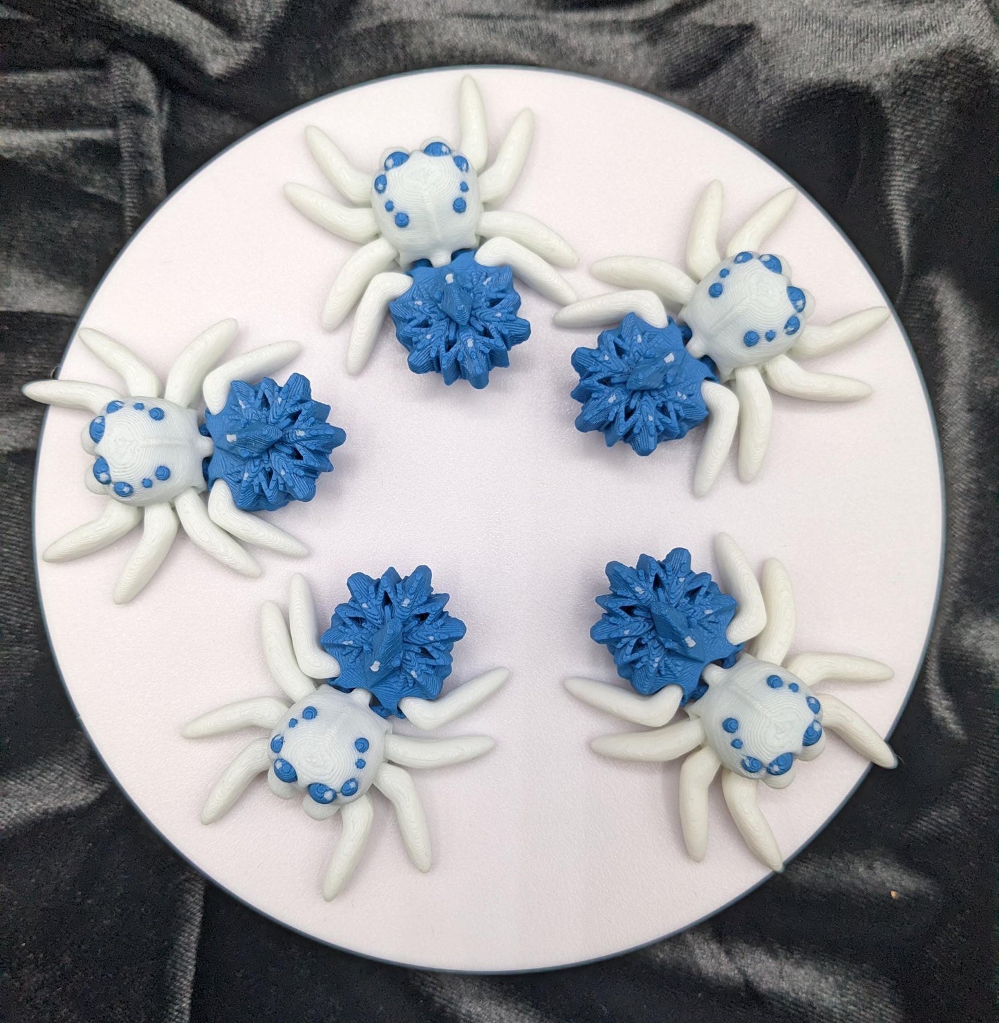 Capture the beauty of winter with our Articulated Snowflake Spider Fidget Toy! This one-of-a-kind spider features intricate snowflake design on its body adding a festive and elegant touch to its playful functionality.