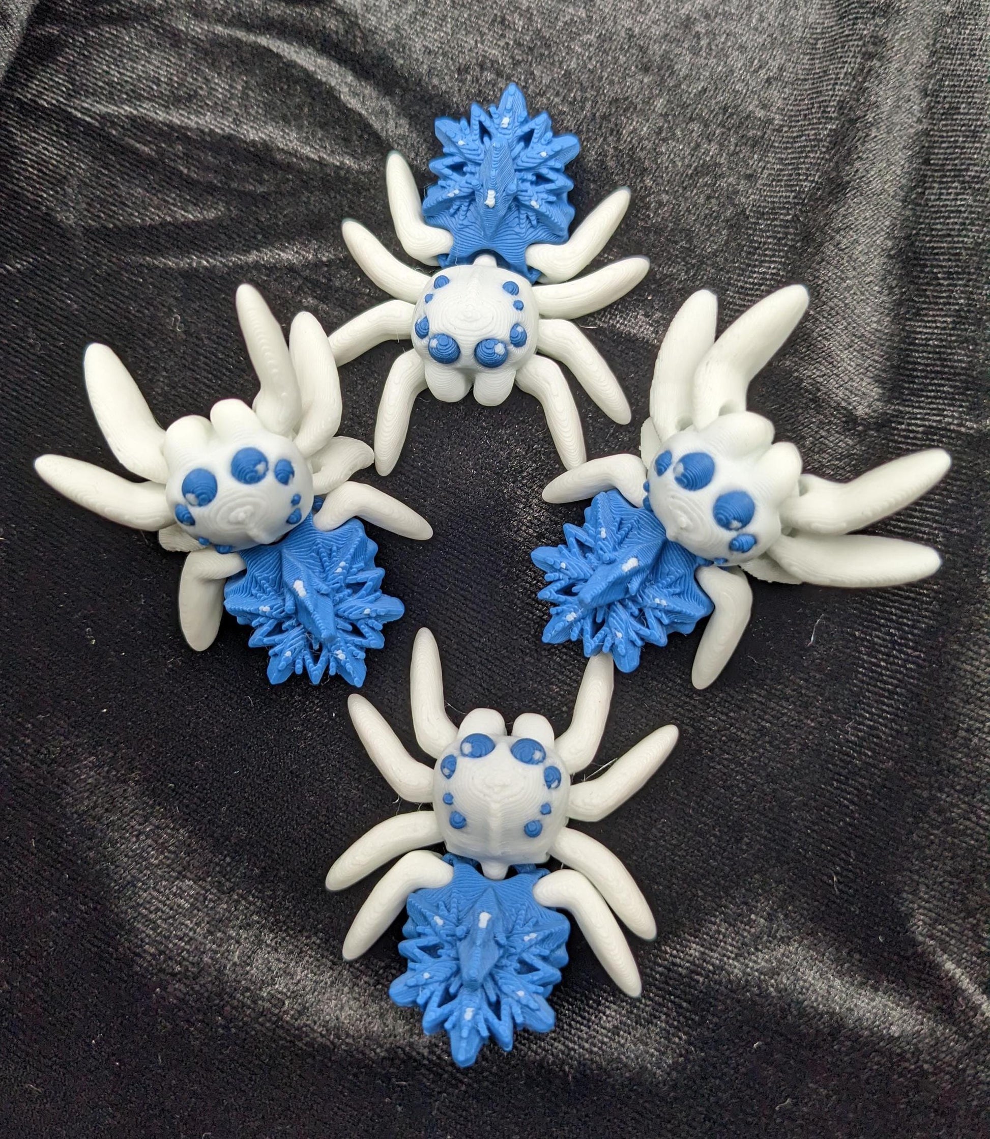 Capture the beauty of winter with our Articulated Snowflake Spider Fidget Toy! This one-of-a-kind spider features intricate snowflake design on its body adding a festive and elegant touch to its playful functionality.