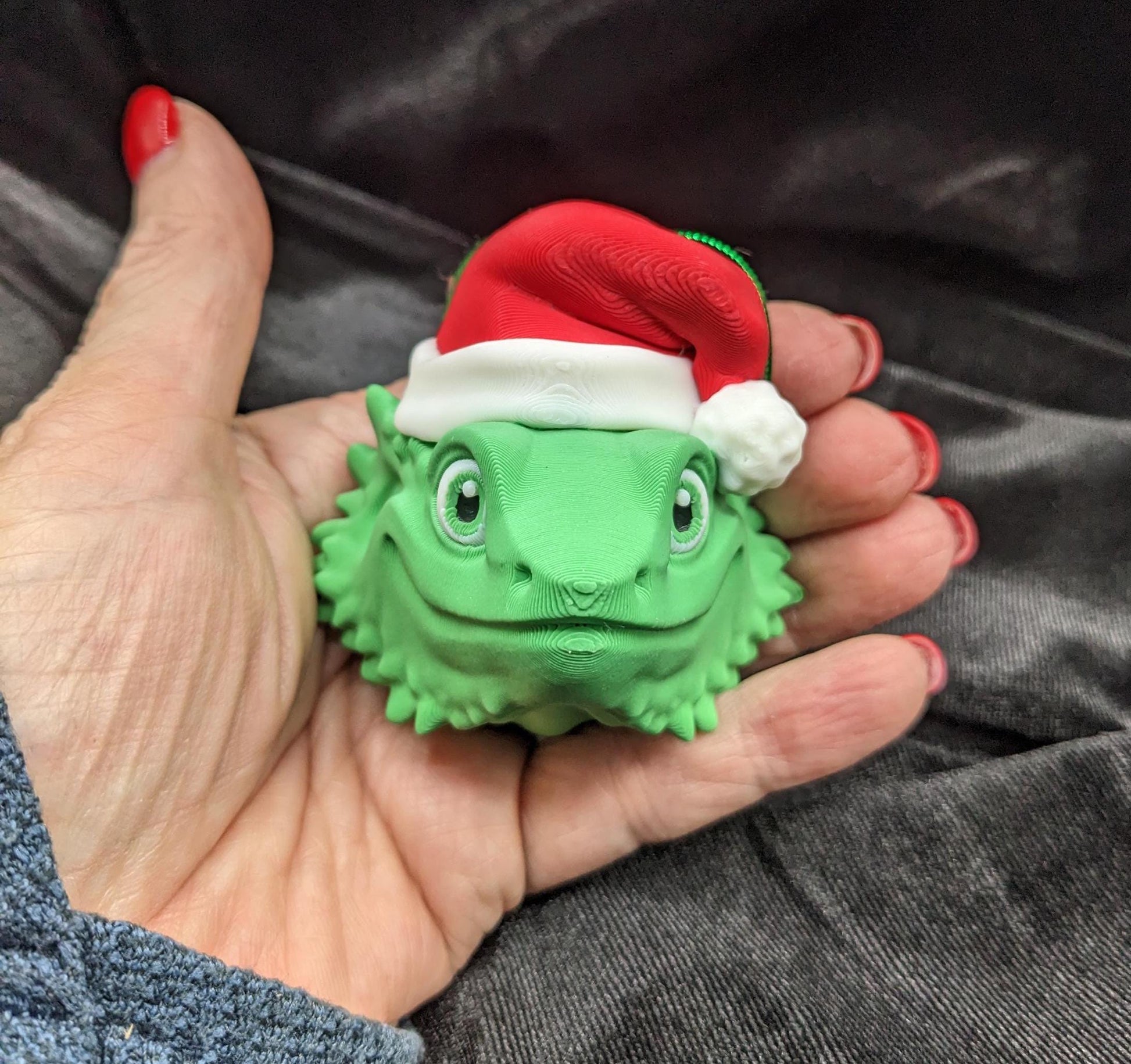 This charming ornament brings a touch of reptilian charm to your Christmas tree, making it a delightful and unique way to celebrate the season.