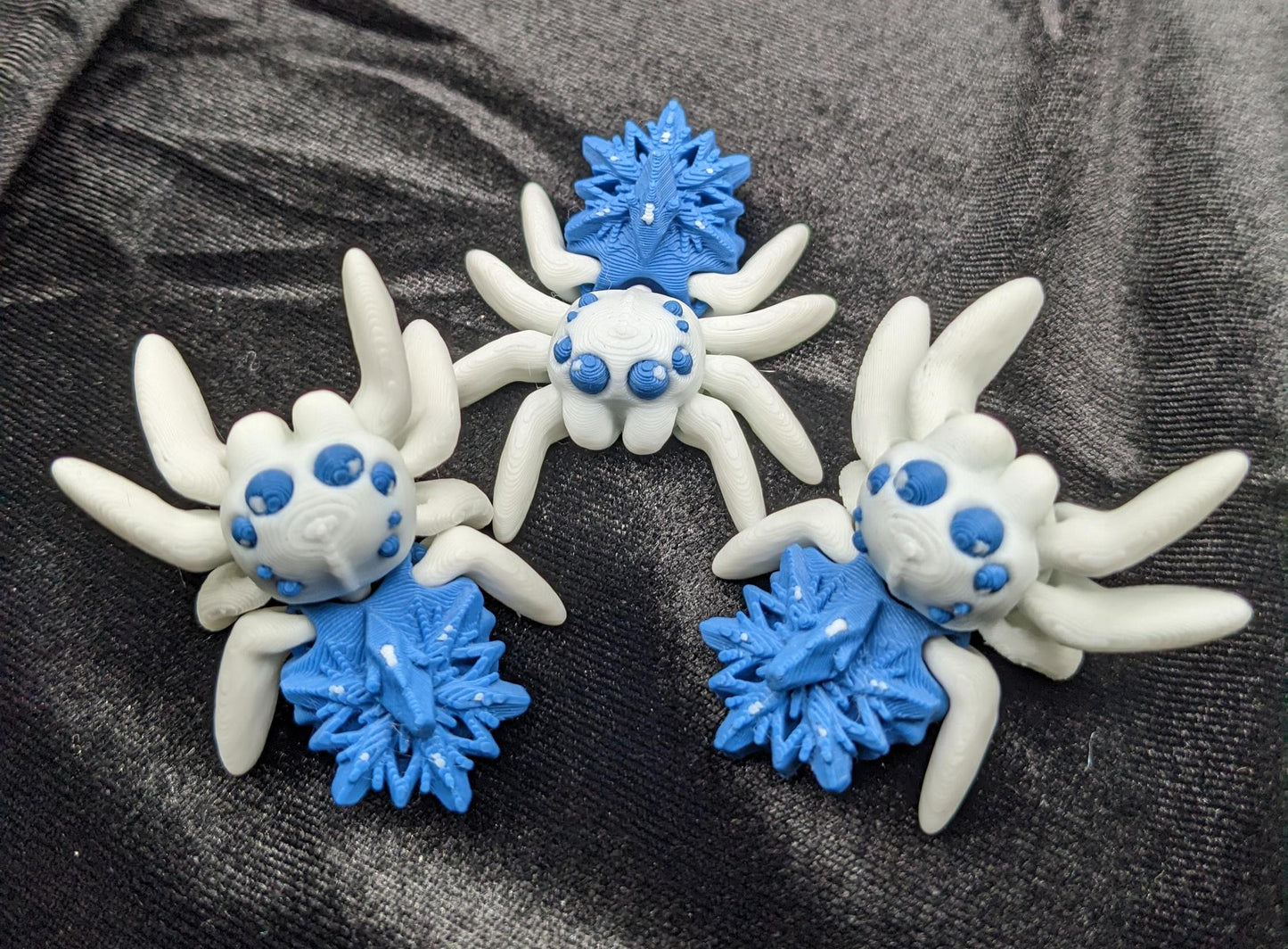 Capture the beauty of winter with our Articulated Snowflake Spider Fidget Toy! This one-of-a-kind spider features intricate snowflake design on its body adding a festive and elegant touch to its playful functionality.