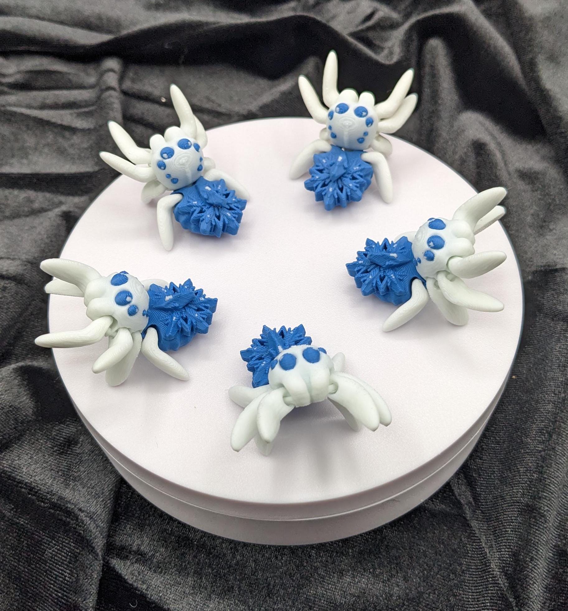 Capture the beauty of winter with our Articulated Snowflake Spider Fidget Toy! This one-of-a-kind spider features intricate snowflake design on its body adding a festive and elegant touch to its playful functionality.