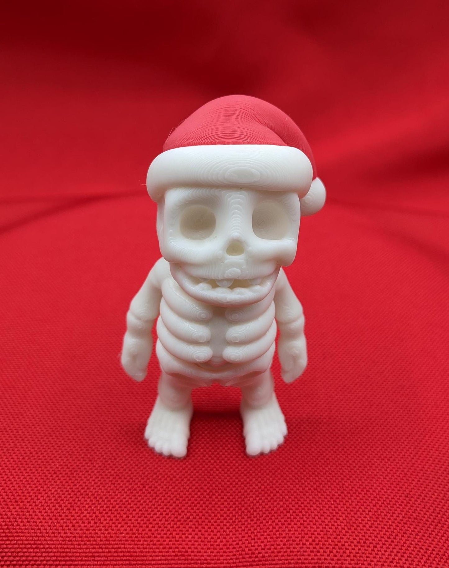 Add a playful twist to your holiday season with the Festive Flexi Christmas Santa Skeleton Fidget Toy! This unique combination of holiday cheer and spooky fun makes it the perfect toy for all ages.