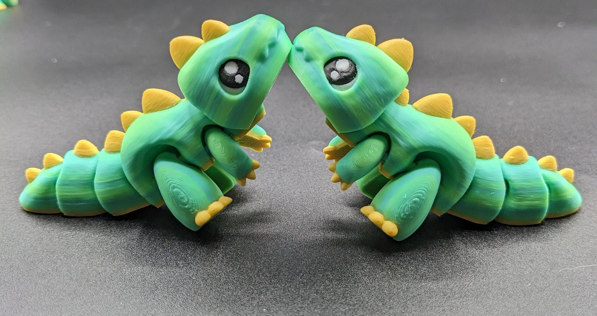 Our Adorable Articulated Baby Trex Flexi Fidget Toy is the perfect pet dinosaur! Our baby Trex  is designed to bring smiles, creativity, & stress relief to your daily routine. Perfect for fidgeting, imaginative play, or as a playful desk companion.