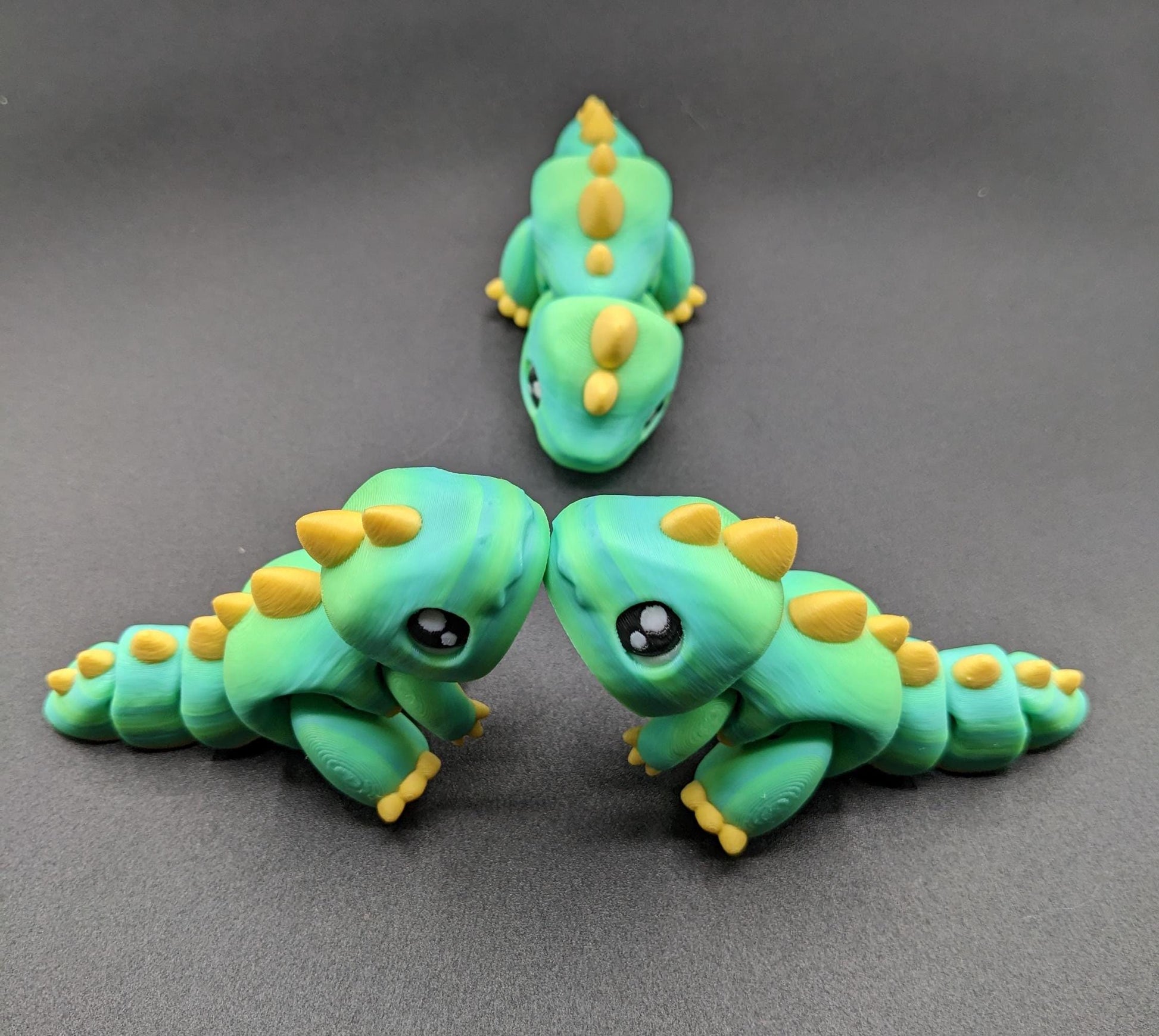 Our Adorable Articulated Baby Trex Flexi Fidget Toy is the perfect pet dinosaur! Our baby Trex  is designed to bring smiles, creativity, & stress relief to your daily routine. Perfect for fidgeting, imaginative play, or as a playful desk companion.