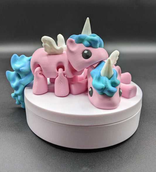 Our Magical Articulated Baby Unicorn Fidget Toy is perfect for fidgeting, imaginative play, or as a whimsical desk accessory. The perfect gift for the unicorn lover in your life or gift for yourself!