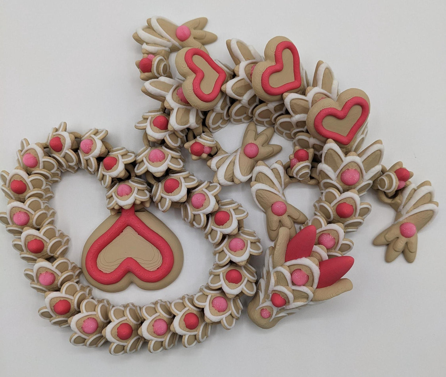 Celebrate love with the Large Articulated Valentine’s Heart Cookie Dragon Fidget Toy! This delightful 3D-printed dragon is inspired by the sweetness of cookies & the magic of Valentine’s Day, making it the perfect gift for someone you love.