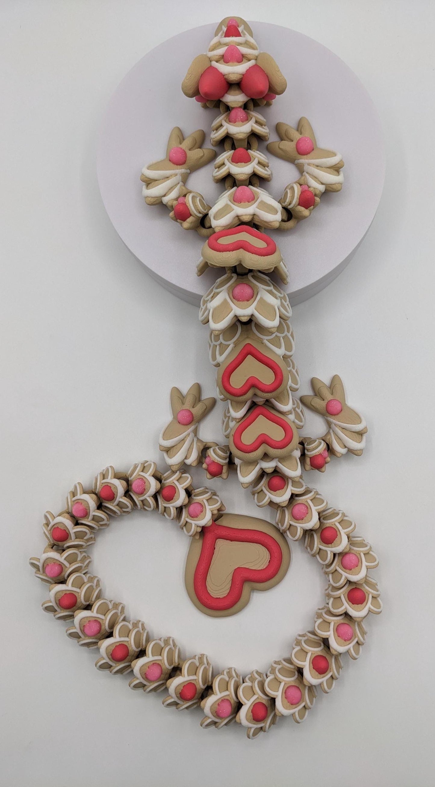 Celebrate love with the Large Articulated Valentine’s Heart Cookie Dragon Fidget Toy! This delightful 3D-printed dragon is inspired by the sweetness of cookies & the magic of Valentine’s Day, making it the perfect gift for someone you love.