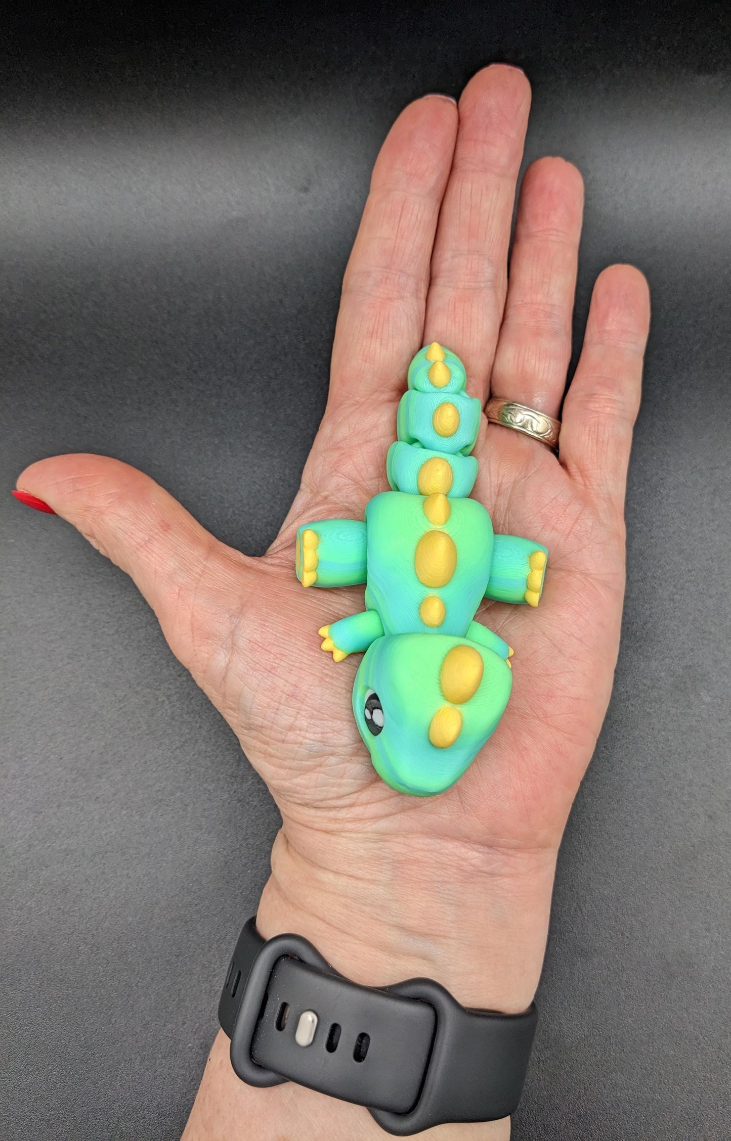 Our Adorable Articulated Baby Trex Flexi Fidget Toy is the perfect pet dinosaur! Our baby Trex  is designed to bring smiles, creativity, & stress relief to your daily routine. Perfect for fidgeting, imaginative play, or as a playful desk companion.