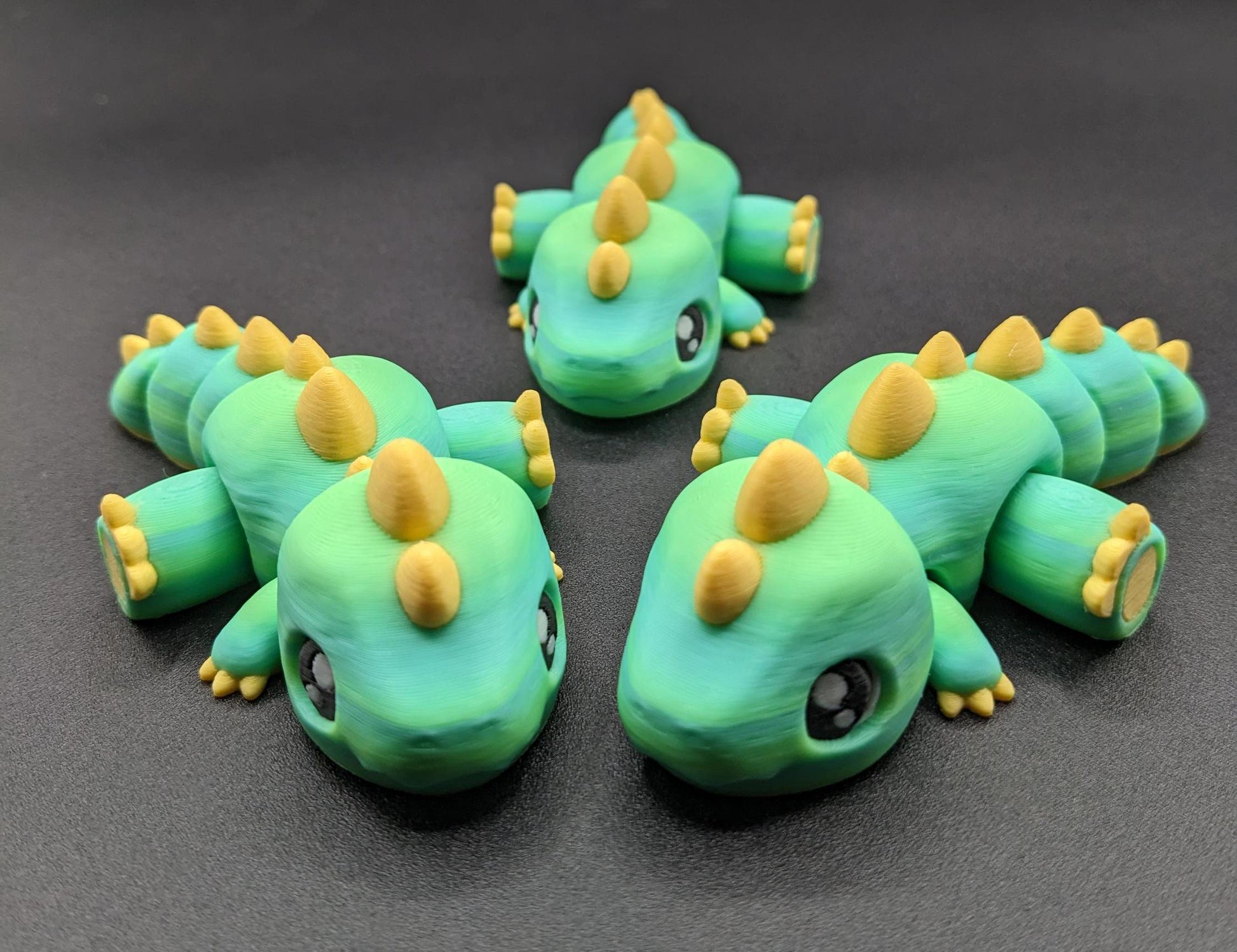 Our Adorable Articulated Baby Trex Flexi Fidget Toy is the perfect pet dinosaur! Our baby Trex  is designed to bring smiles, creativity, & stress relief to your daily routine. Perfect for fidgeting, imaginative play, or as a playful desk companion.