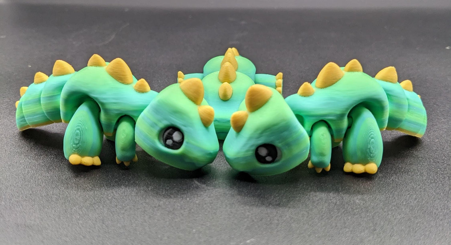 Our Adorable Articulated Baby Trex Flexi Fidget Toy is the perfect pet dinosaur! Our baby Trex  is designed to bring smiles, creativity, & stress relief to your daily routine. Perfect for fidgeting, imaginative play, or as a playful desk companion.