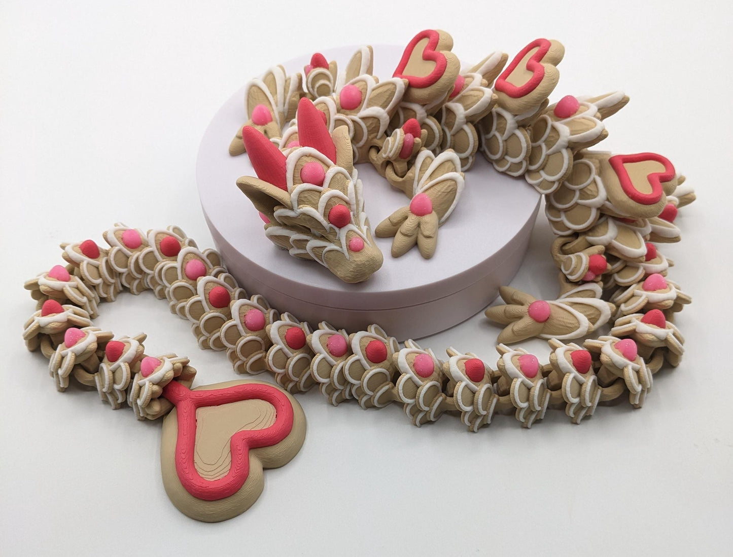 Celebrate love with the Large Articulated Valentine’s Heart Cookie Dragon Fidget Toy! This delightful 3D-printed dragon is inspired by the sweetness of cookies & the magic of Valentine’s Day, making it the perfect gift for someone you love.
