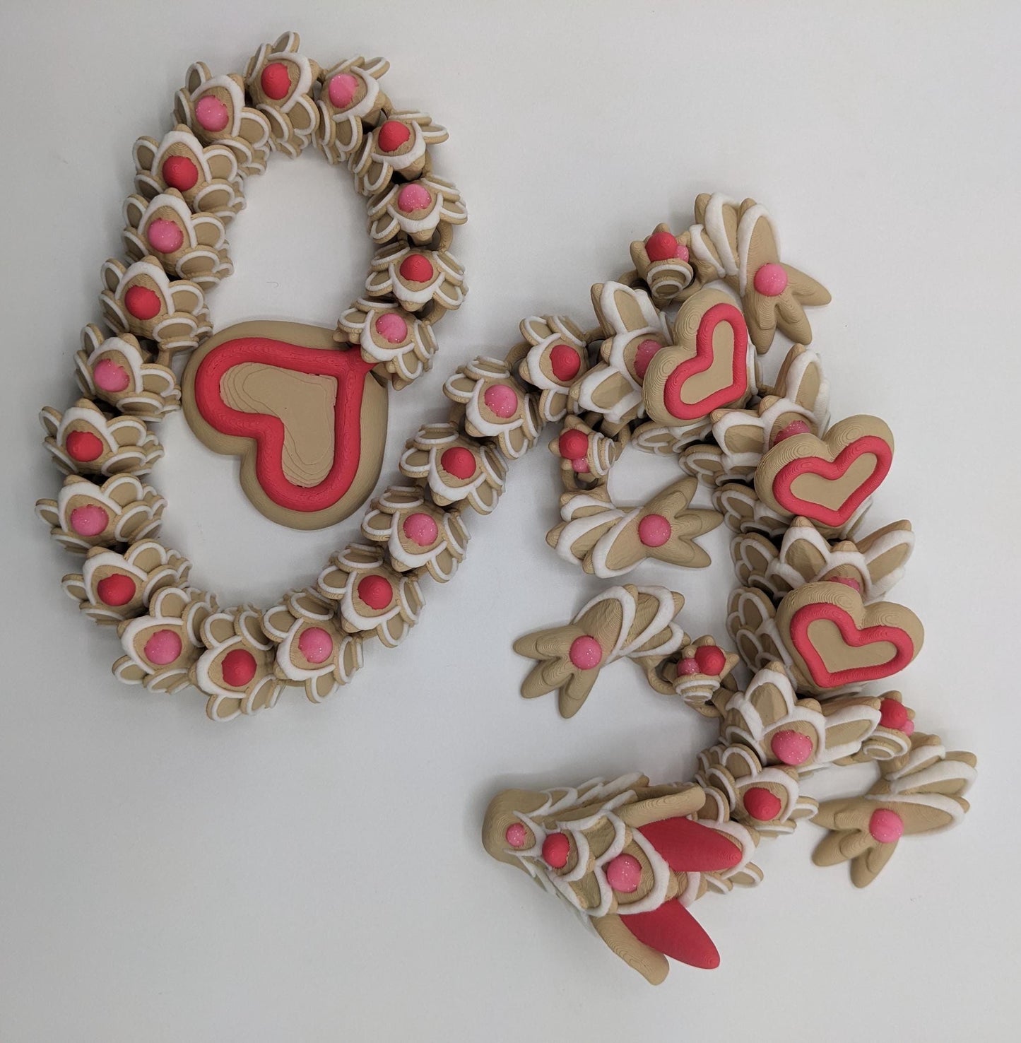 Celebrate love with the Large Articulated Valentine’s Heart Cookie Dragon Fidget Toy! This delightful 3D-printed dragon is inspired by the sweetness of cookies & the magic of Valentine’s Day, making it the perfect gift for someone you love.