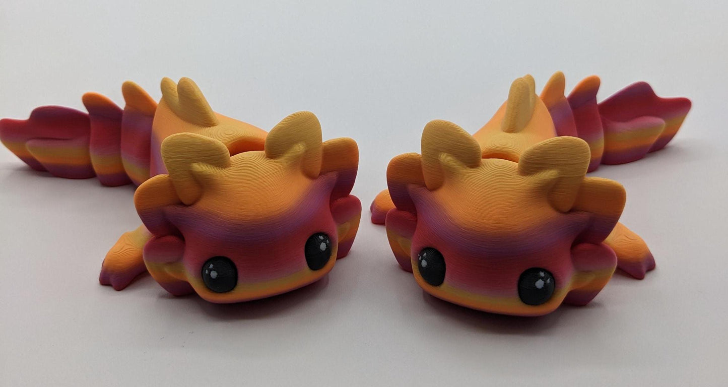 Meet the Adorable Articulated Axolotl Tadpole Fidget Toy, the perfect blend of cuteness and functionality! This 3D-printed axolotl-inspired design features fully articulated joints, making it both fun to fidget with and charming to display.