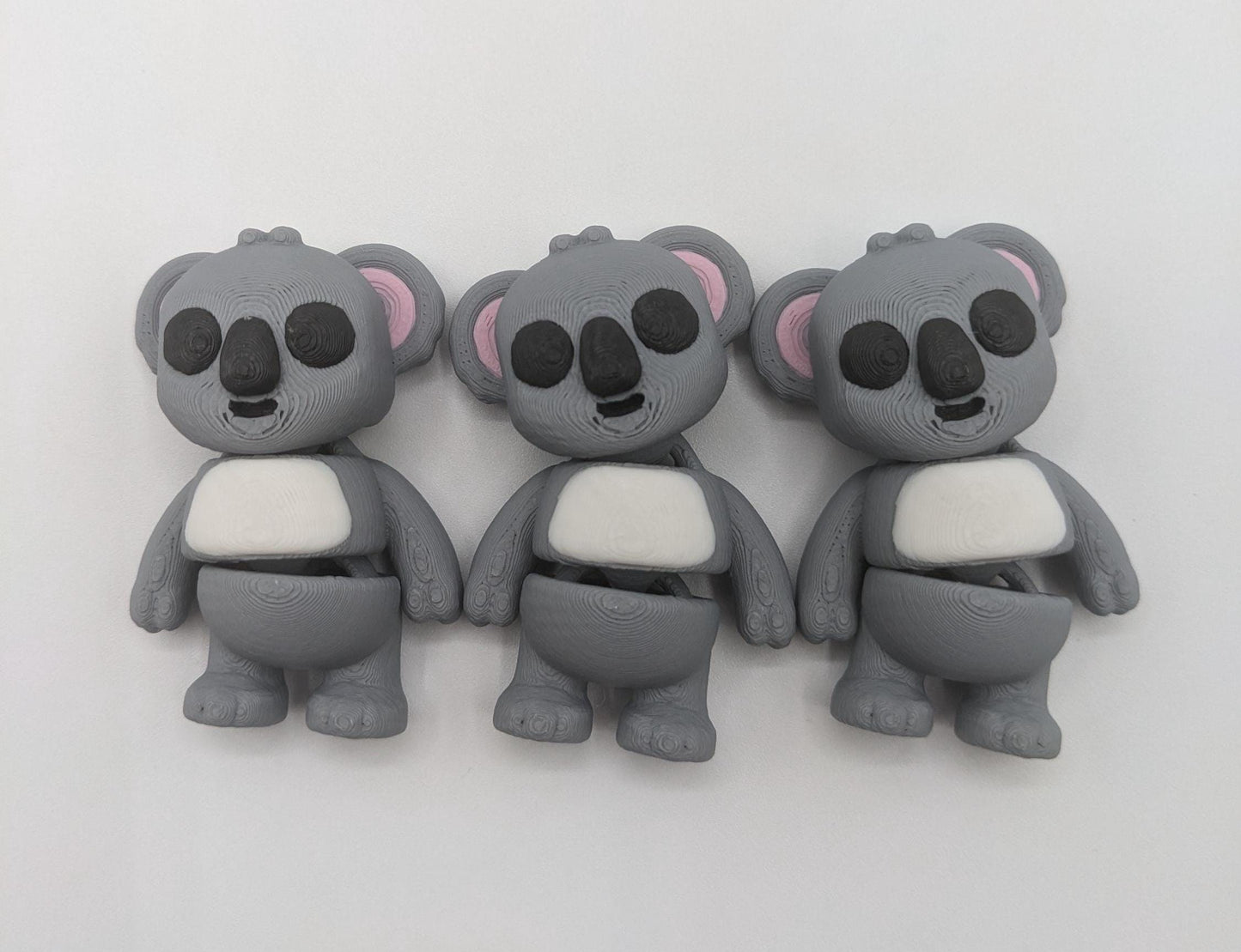 Bring cuteness and relaxation to your day with the Adorable Tiny Articulated Koala Fidget Toy! This charming 3D-printed koala is designed with  articulated joints, making it perfect for fidgeting, creative play, or as a fun pocket sized friend!