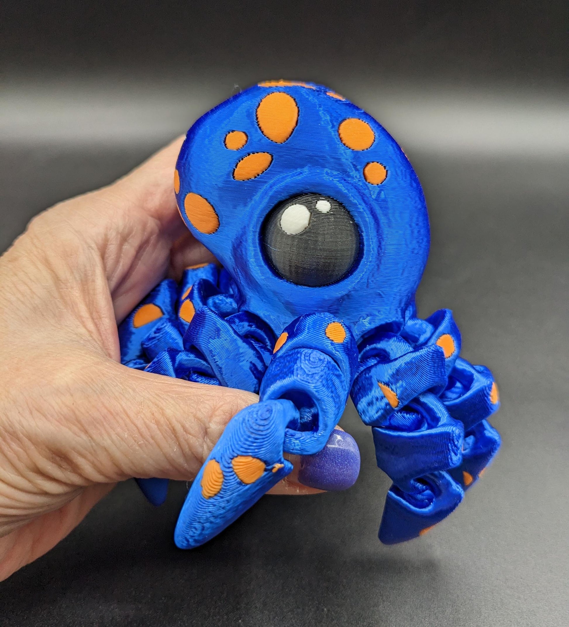 Dive into a world of cuteness and fun with the Adorable Articulated Tiny Octopus! This charming 3D-printed octopus features fully articulated tentacles, making it perfect as a relaxing fidget toy, a playful desk companion