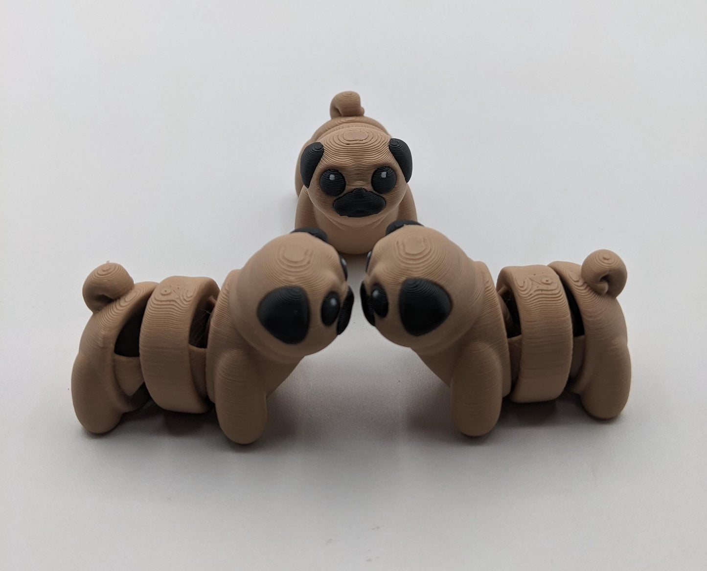 Say hello to the Adorable Articulated Pug Dog Fidget Toy, the perfect combination of cuteness and functionality! Whether you’re a pug lover, a fidget toy enthusiast, or looking for a unique gift, this playful pup is sure to bring joy to your day.