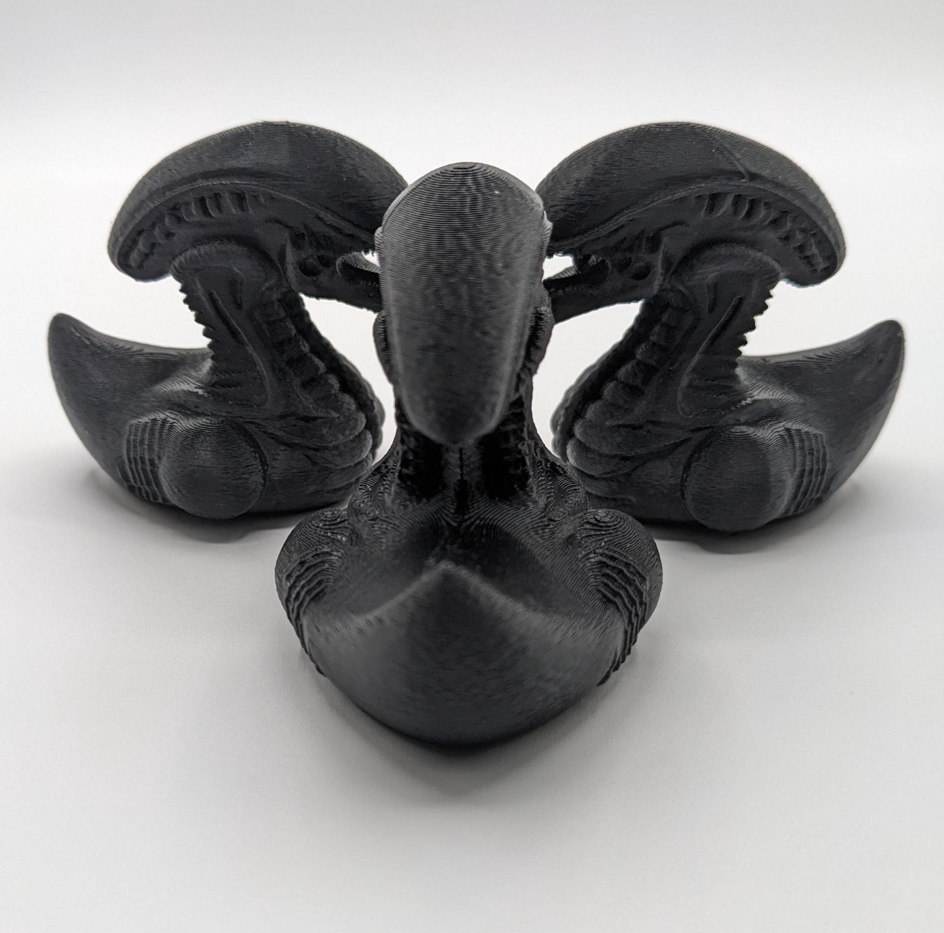 Step into the world of sci-fi and whimsy with the Alien Xenomorph Duck! This one-of-a-kind 3D-printed creation combines the eerie, iconic design of an alien xenomorph with the playful charm of a duck. Perfect for fans of alien creatures, sci-fi enthusiasts, Jeep duck collectors, or anyone who loves quirky collectibles, this hybrid figurine is sure to stand out in any collection.