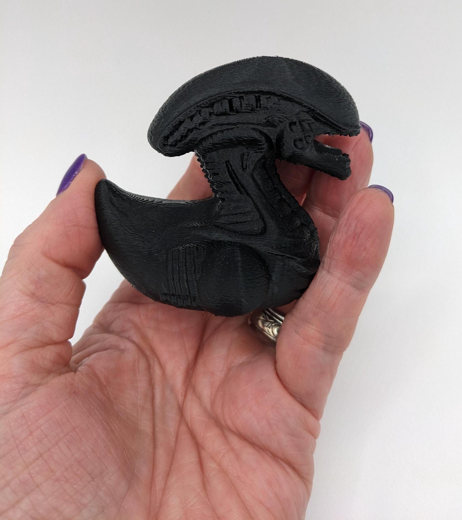 Step into the world of sci-fi and whimsy with the Alien Xenomorph Duck! This one-of-a-kind 3D-printed creation combines the eerie, iconic design of an alien xenomorph with the playful charm of a duck. Perfect for fans of alien creatures, sci-fi enthusiasts, Jeep duck collectors, or anyone who loves quirky collectibles, this hybrid figurine is sure to stand out in any collection.