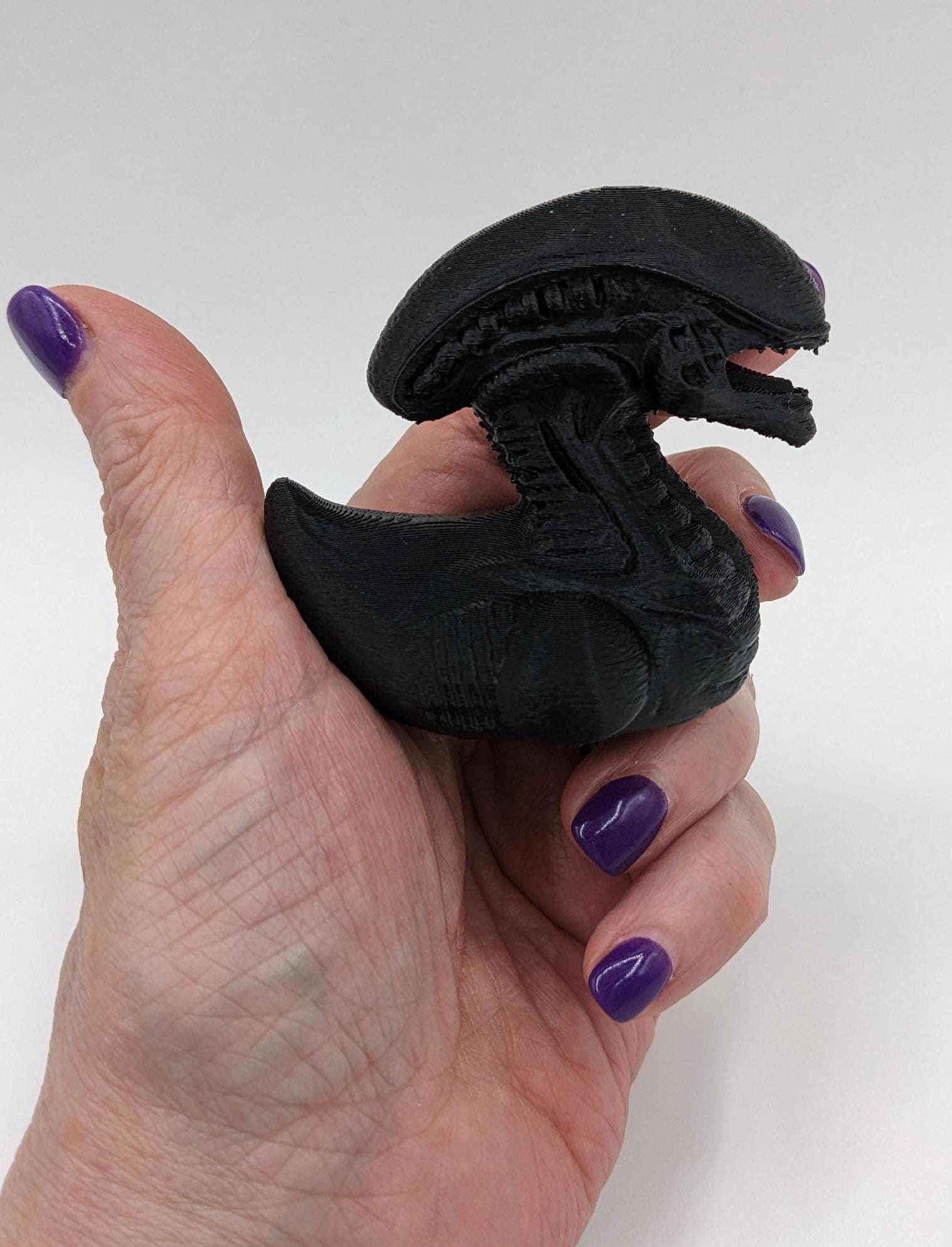 Step into the world of sci-fi and whimsy with the Alien Xenomorph Duck! This one-of-a-kind 3D-printed creation combines the eerie, iconic design of an alien xenomorph with the playful charm of a duck. Perfect for fans of alien creatures, sci-fi enthusiasts, Jeep duck collectors, or anyone who loves quirky collectibles, this hybrid figurine is sure to stand out in any collection.
