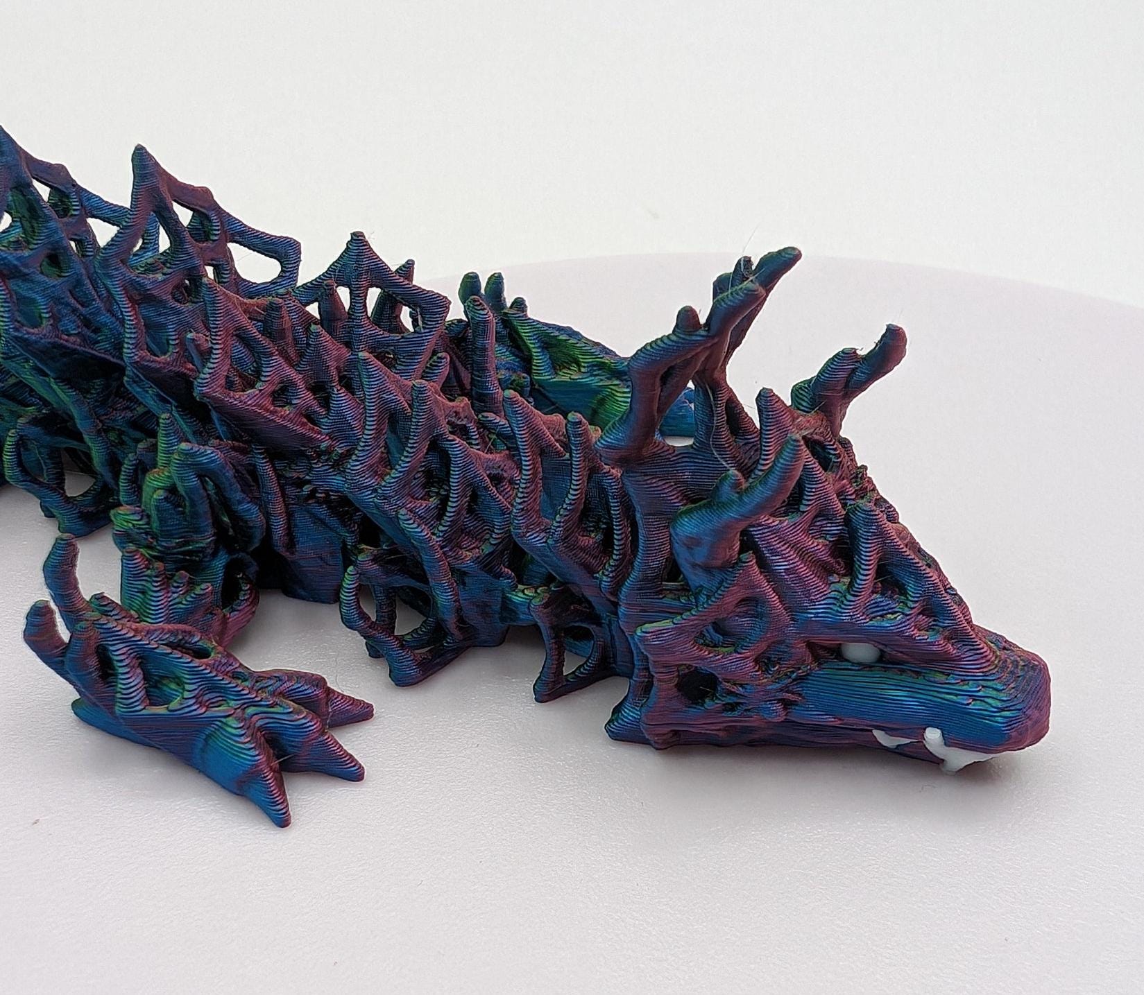 Embrace the allure of darkness and fantasy with the 3D Printed Wicked Dragon by Cinderwing. Order yours today and let this mesmerizing creature take you on a journey into the shadows. Don&#39;t miss the opportunity to own a piece of art that celebrates the mystique of the wicked and the extraordinary.