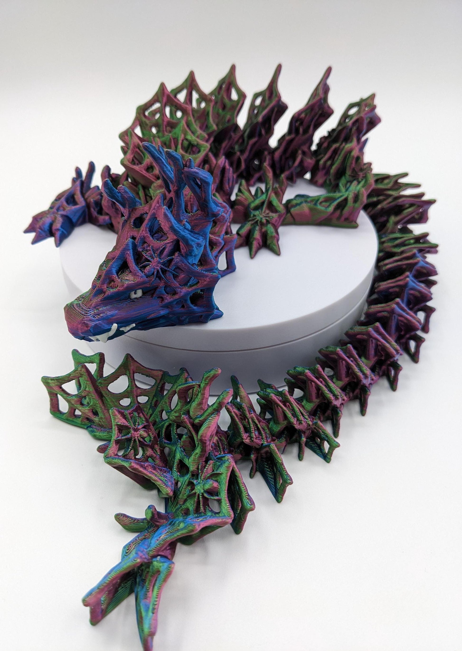 Embrace the allure of darkness and fantasy with the 3D Printed Wicked Dragon by Cinderwing. Order yours today and let this mesmerizing creature take you on a journey into the shadows. Don&#39;t miss the opportunity to own a piece of art that celebrates the mystique of the wicked and the extraordinary.