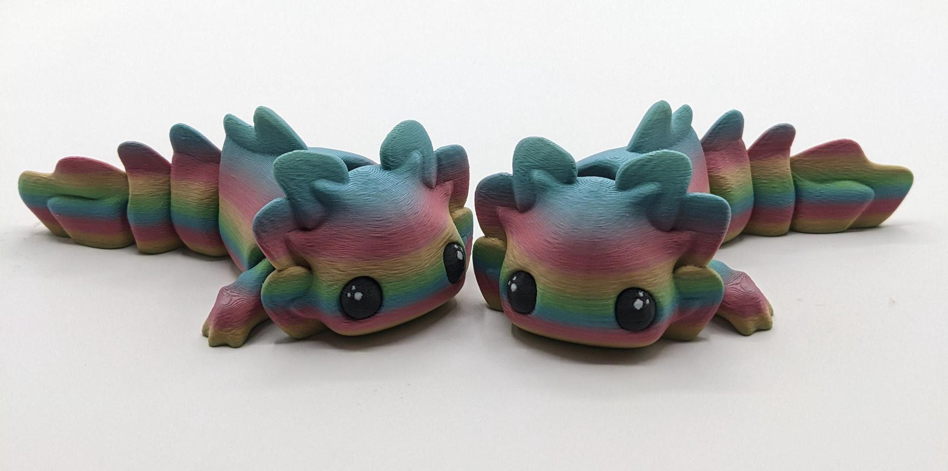 Meet the Adorable Articulated Axolotl Tadpole Fidget Toy, the perfect blend of cuteness and functionality! This 3D-printed axolotl-inspired design features fully articulated joints, making it both fun to fidget with and charming to display.