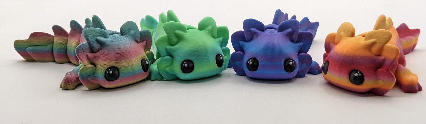 Meet the Adorable Articulated Axolotl Tadpole Fidget Toy, the perfect blend of cuteness and functionality! This 3D-printed axolotl-inspired design features fully articulated joints, making it both fun to fidget with and charming to display.