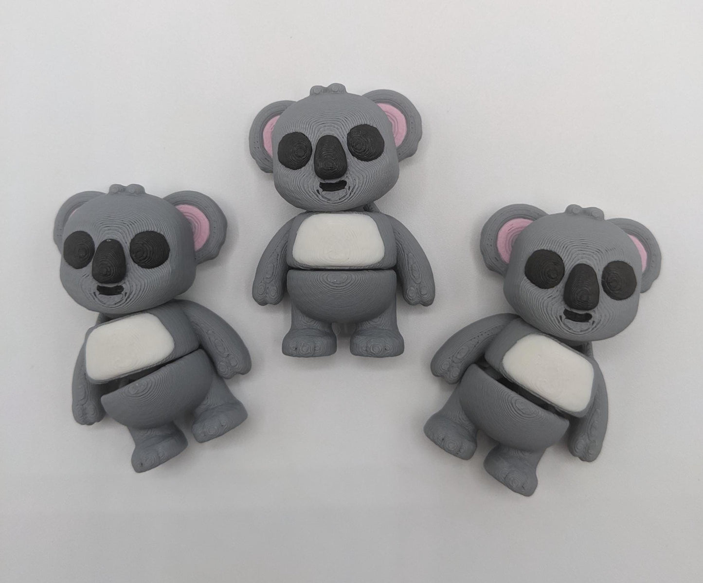 Bring cuteness and relaxation to your day with the Adorable Tiny Articulated Koala Fidget Toy! This charming 3D-printed koala is designed with  articulated joints, making it perfect for fidgeting, creative play, or as a fun pocket sized friend!